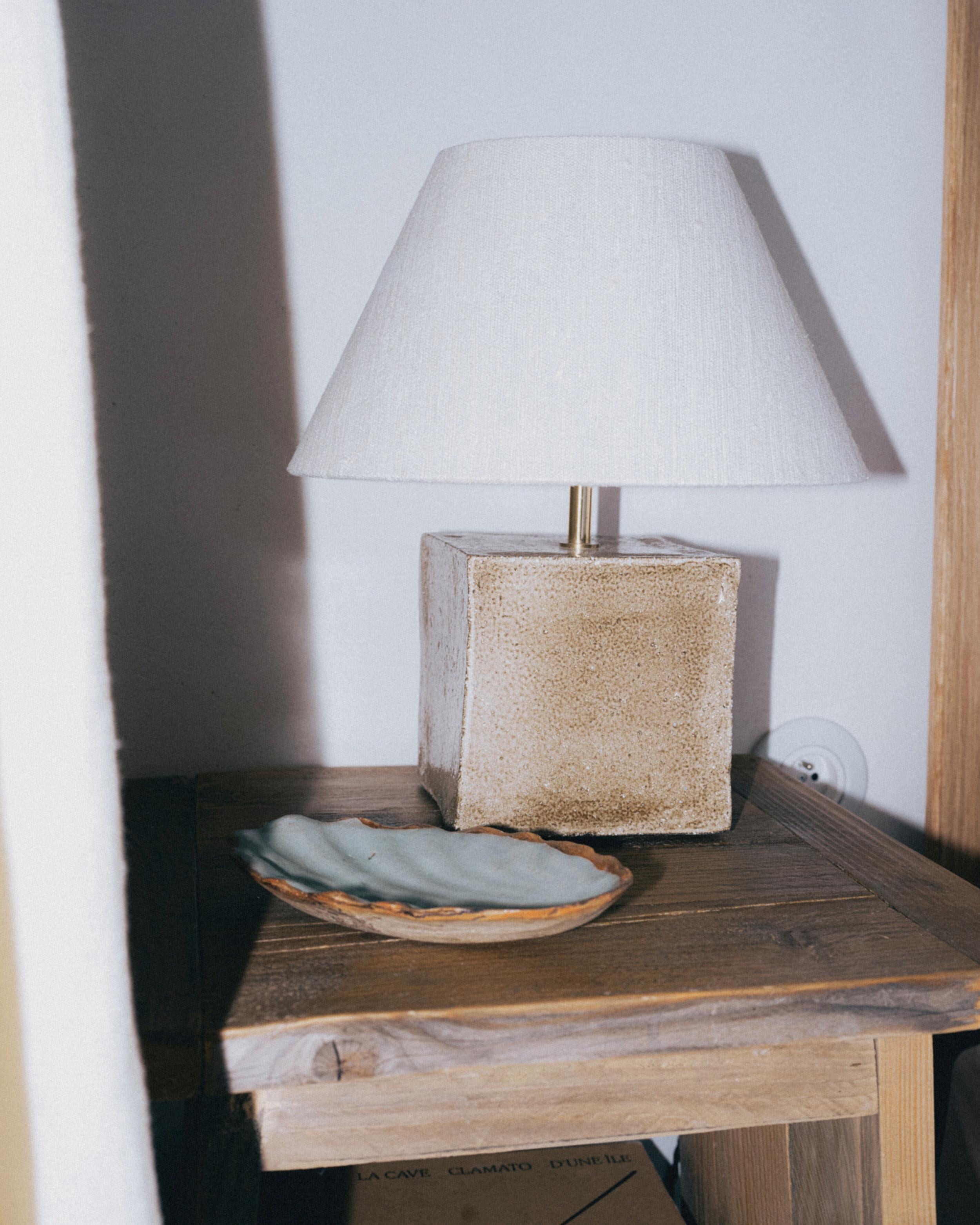 AROUCA TABLE LIGHT, designed in 2024.

Artisanal table light with a cube ceramic base, made in Project 213A's own ceramic workshop. Each piece is unique due to its handmade nature, shapes and shades of the ceramic base can vary slightly. 

Bespoke
