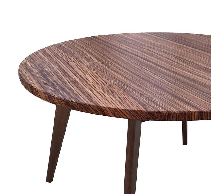 Entirely handcrafted, this elegant table has a chic 1950s style silhouette treated with an alkaline Woca color that confers a sophisticated, natural-gray hue. The zebra wood top (32-mm thick) is treated with an clear, acrylic-based glossy varnish