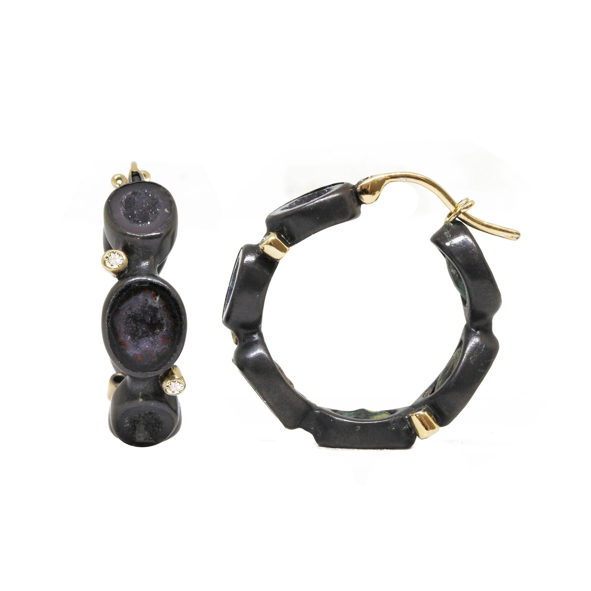 Gorgeous black geodes form the Around The World Geode Silver Hoop Earrings, which bring a mysterious, organic edge to your look. To make them feel extra luxe—and pop on the ear—we added tiny diamond accents set in 18k yellow gold. Wear these silver