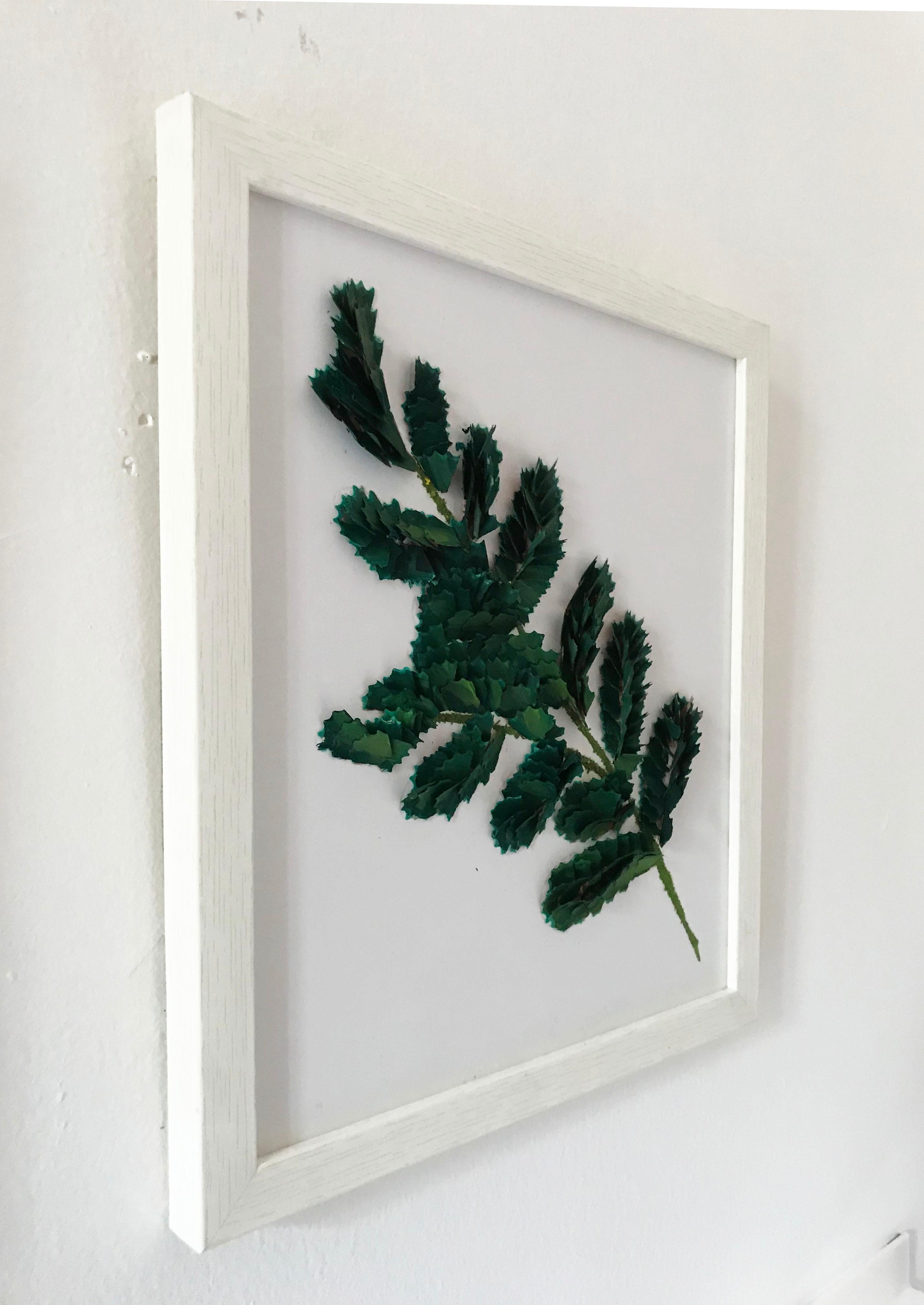 An elegant and detailed art work, perfect for decorating minimalistic spaces. The two colors: white and green give a serene look to the place. 

These three pieces were done delicately with pencil wood chips. Each piece was placed upon its