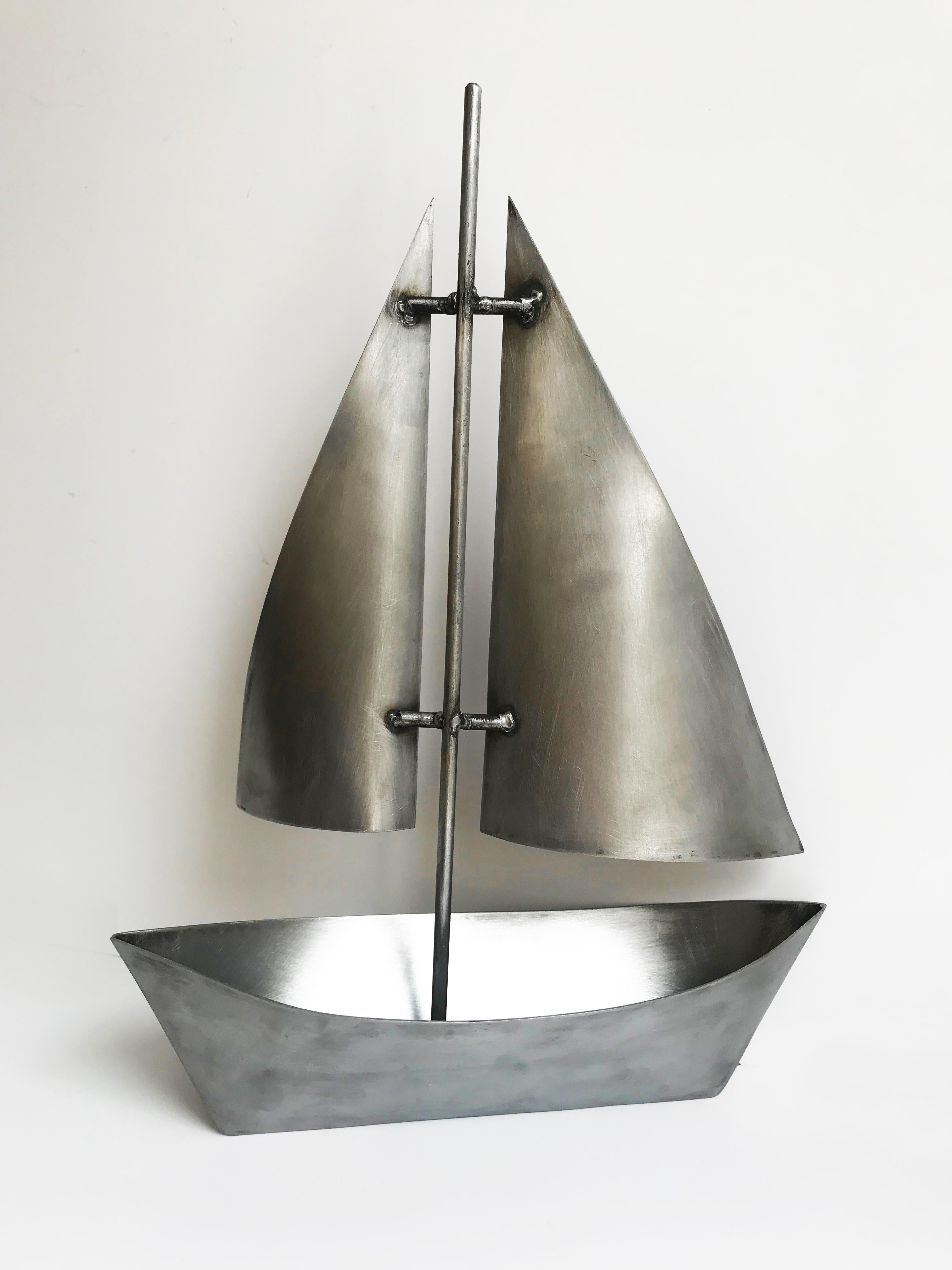 large metal sailboat sculpture