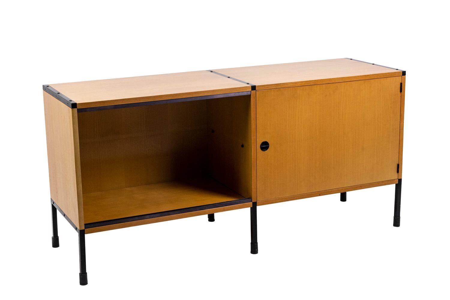 ARP, attributed to.
Charles Minvielle, edited by. 

Sideboard, ash structure and black lacquered metal base, with adjustable jacks. It opens with a door on the right with an openwork cuff and two transparent glass sliding doors on the