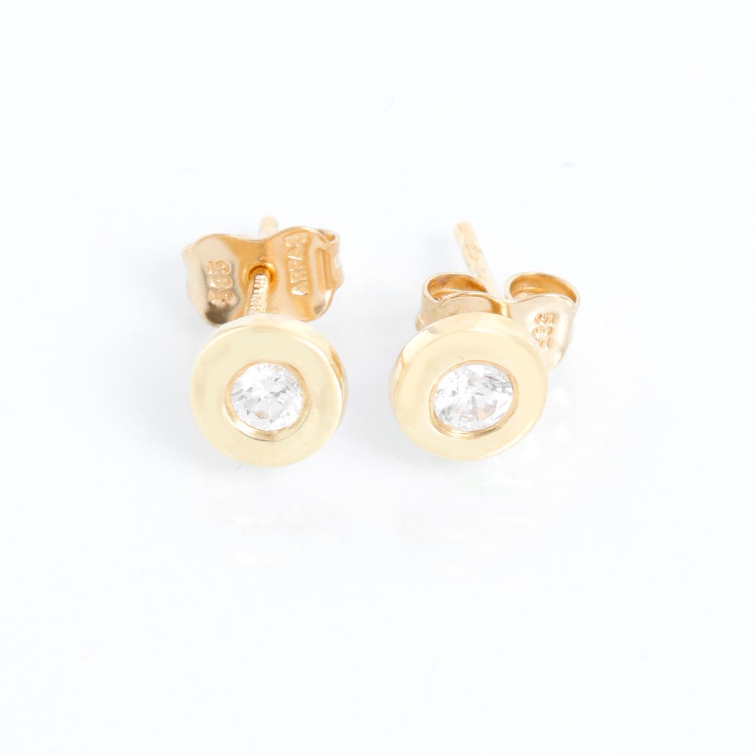 Arpas 14K Yellow Gold  Diamond Bezel Set Studs - Approx. .30 carats -Diamond color H -Diamond clarity SI2. Measure 6 mm width. Perfect for an every day stud. Hallmarked.