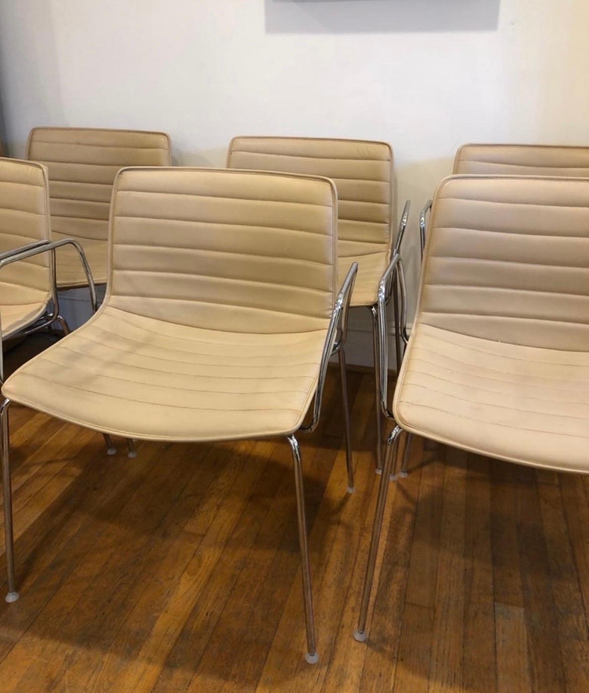 10 Available (Sold individually). Retail $1,971 plus tax each.  Buy now with no lead time.  

Top of the line custom made Catina 53 chairs made by Arper in Italy.   
They have steel base with removable arms.

Upgraded Elmosoft Leather shell in light