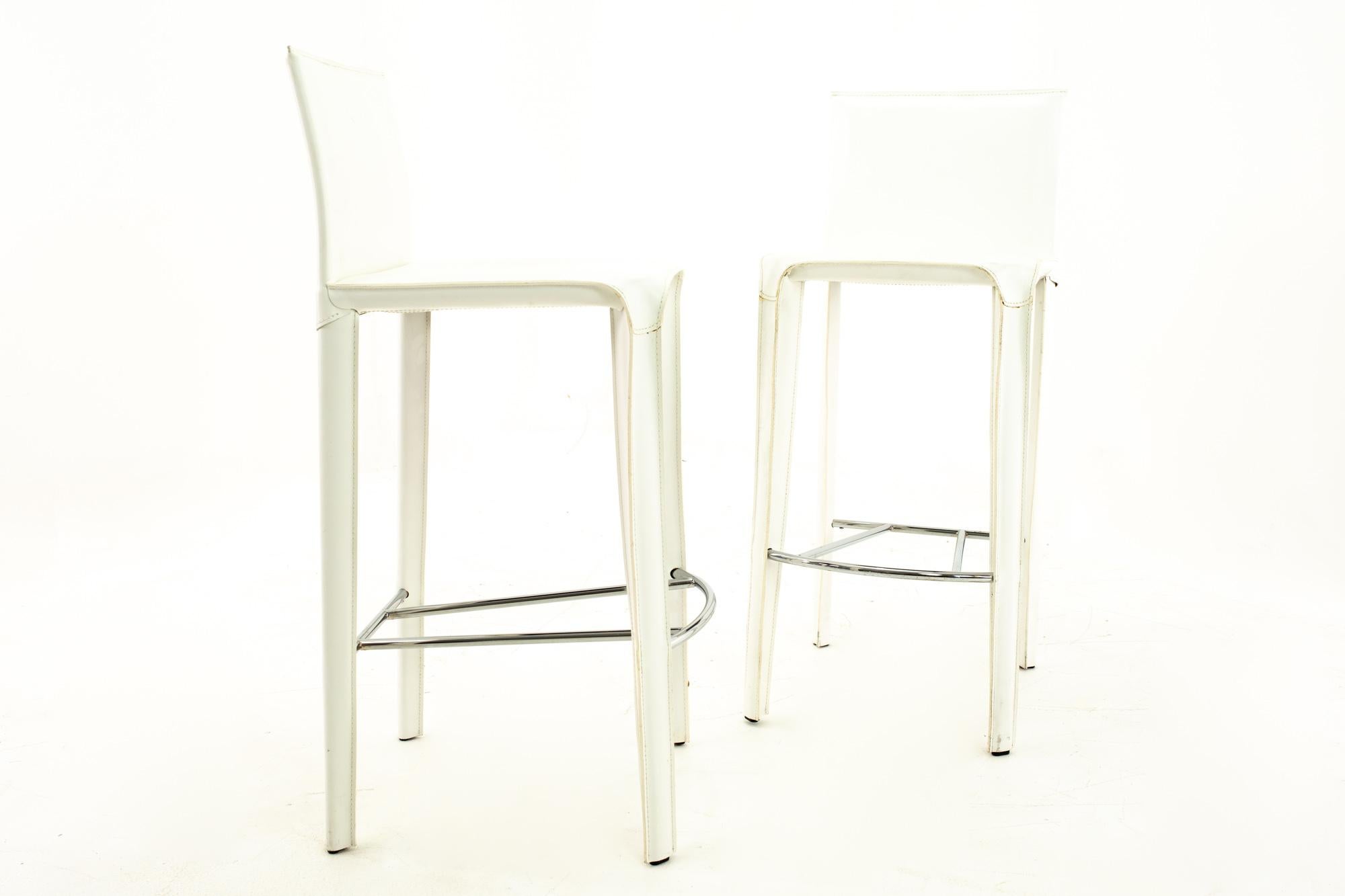 Arper Mid Century white leather stools - Pair

Each stool measures: 18 wide x 18 deep x 42 high with a seat height of 32 inches

All furniture can be had in what we call restored vintage condition. This means the piece is restored upon purchase