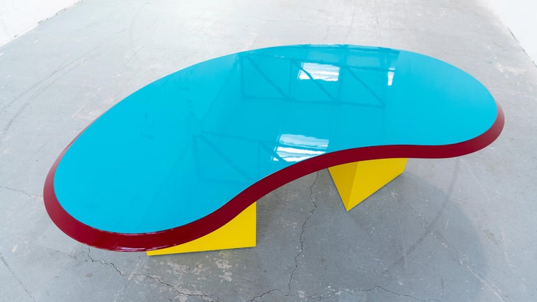 Madonna table by Arquitectonica Miami for Memphis Milano, 1984. 
Iconic an extremely rare postmodern piece and one of the only Memphis Group productions whose design was commissioned from an outside firm.
 
Arquitectonica was a Miami design firm