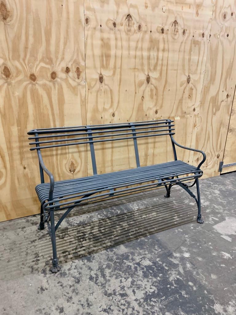Antique French wrought iron bench in a warm grey color, made by the renowned manufacturer Grassin in Arras. The bench is in very good condition, has a great size that would fit easily in most terasses, gardens, hall ways or living room.