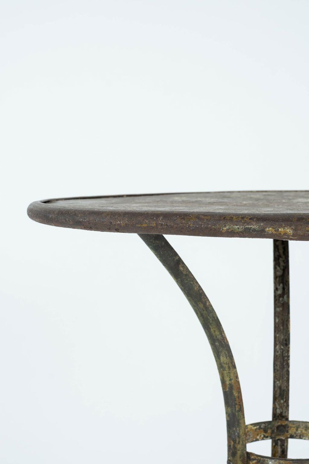 Arras iron garden table circa 1880. Remnants of early, or original, paint.

Note: Original/early finish on antique and vintage metal will include some, or all, of the following: patina, scaling, light rust, discoloration, and corrosion.