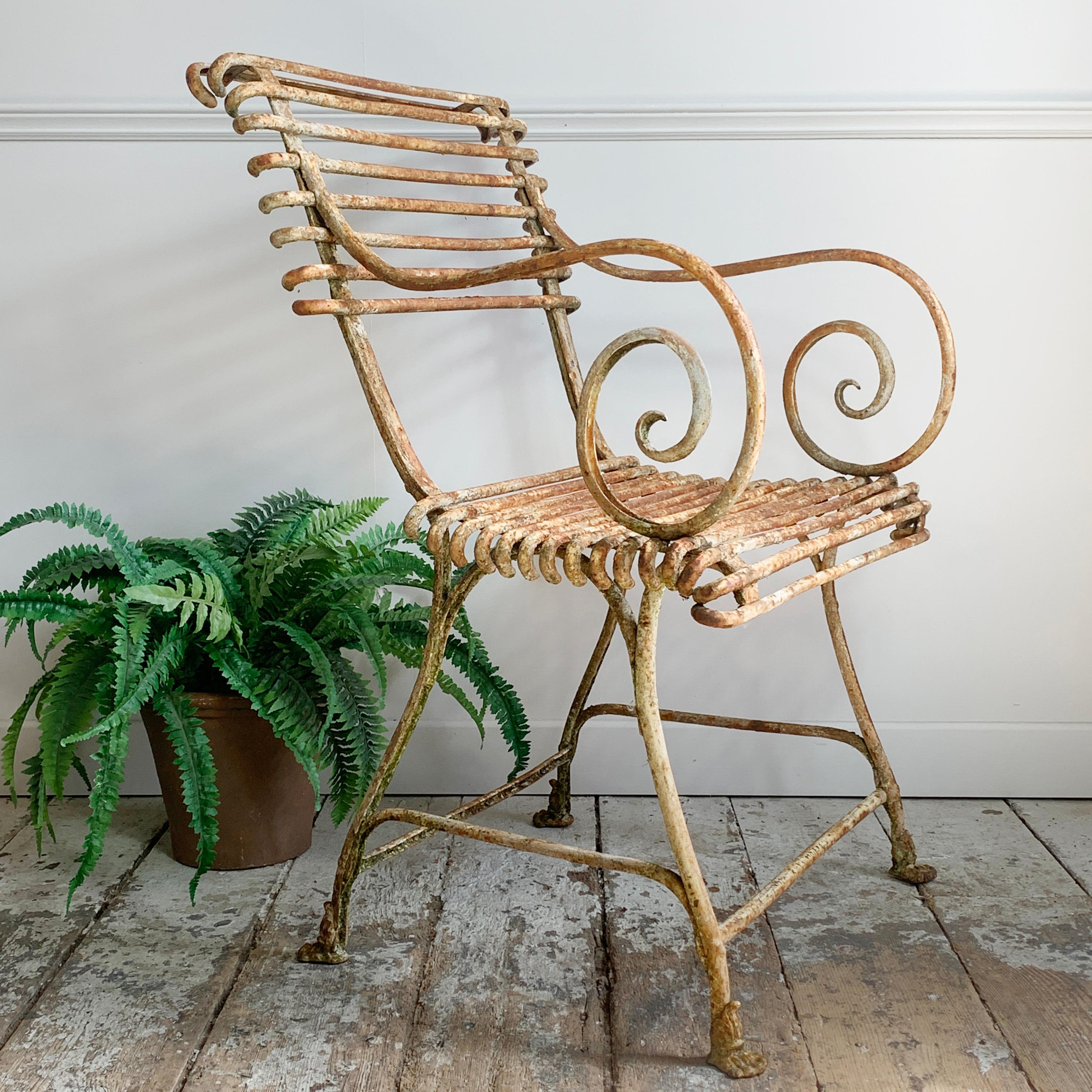 These are the original antique Arras, not to be confused with modern reproductions.

Absolutely beautiful set of three antique Arras iron chair with arms. These are the very early 19th century Lion Paw model, and are much rarer and more desirable