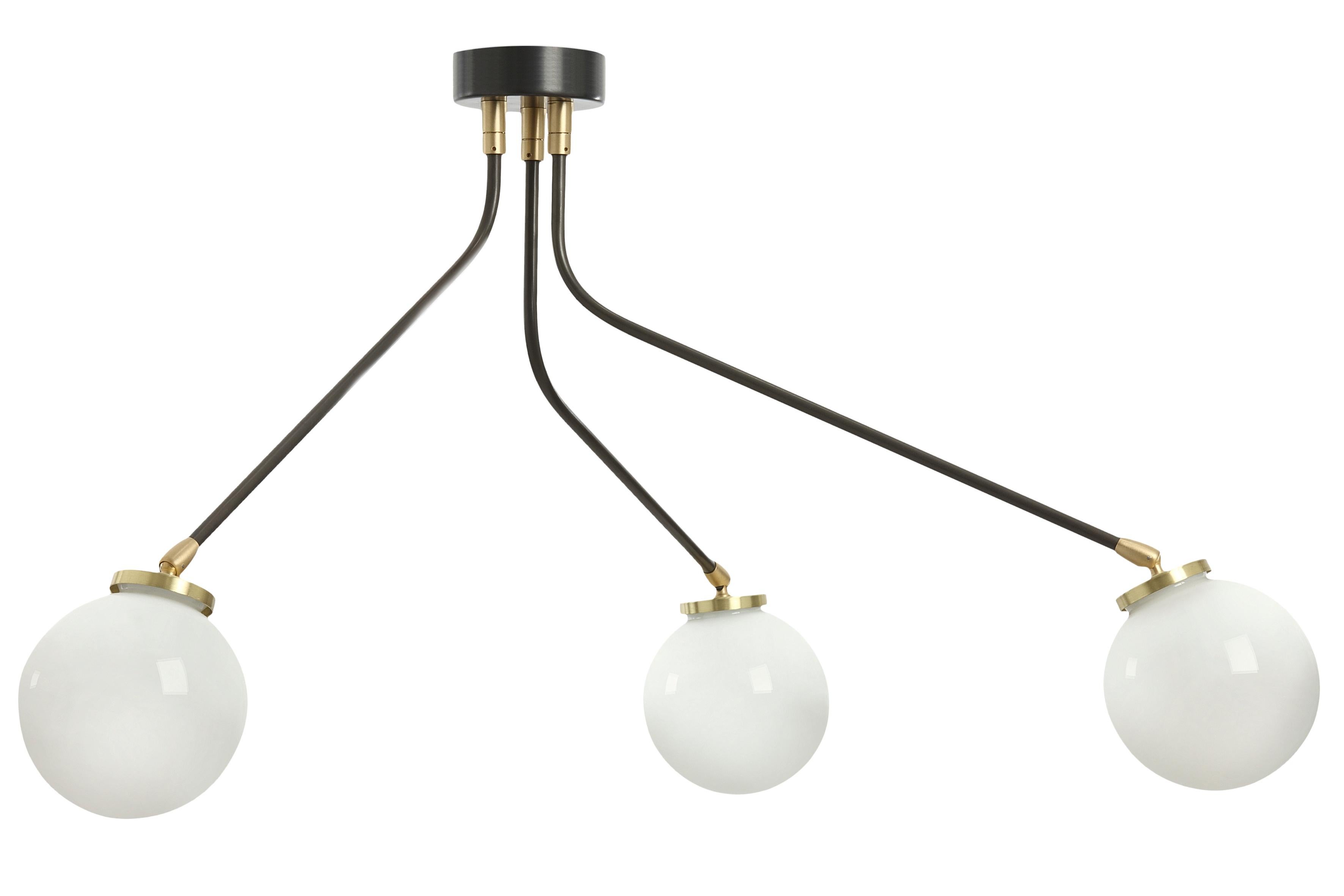 Array mini opal pendant light by CTO Lighting
Materials: bronze with satin brass details and opal glass shades
Dimensions: H 42.5 x W 75 cm

All our lamps can be wired according to each country. If sold to the USA it will be wired for the USA