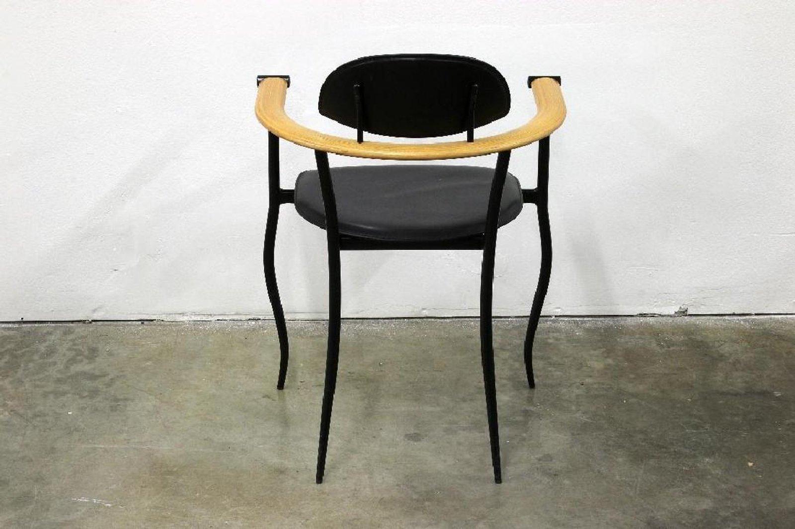 Curvaceous custom 'stilletto' chairs by Arrben with squiggly ebonized steel frames, stitched leather black and saddle upholstery.  Sleek, Italian, Post-Modern and in good vintage condition.  
