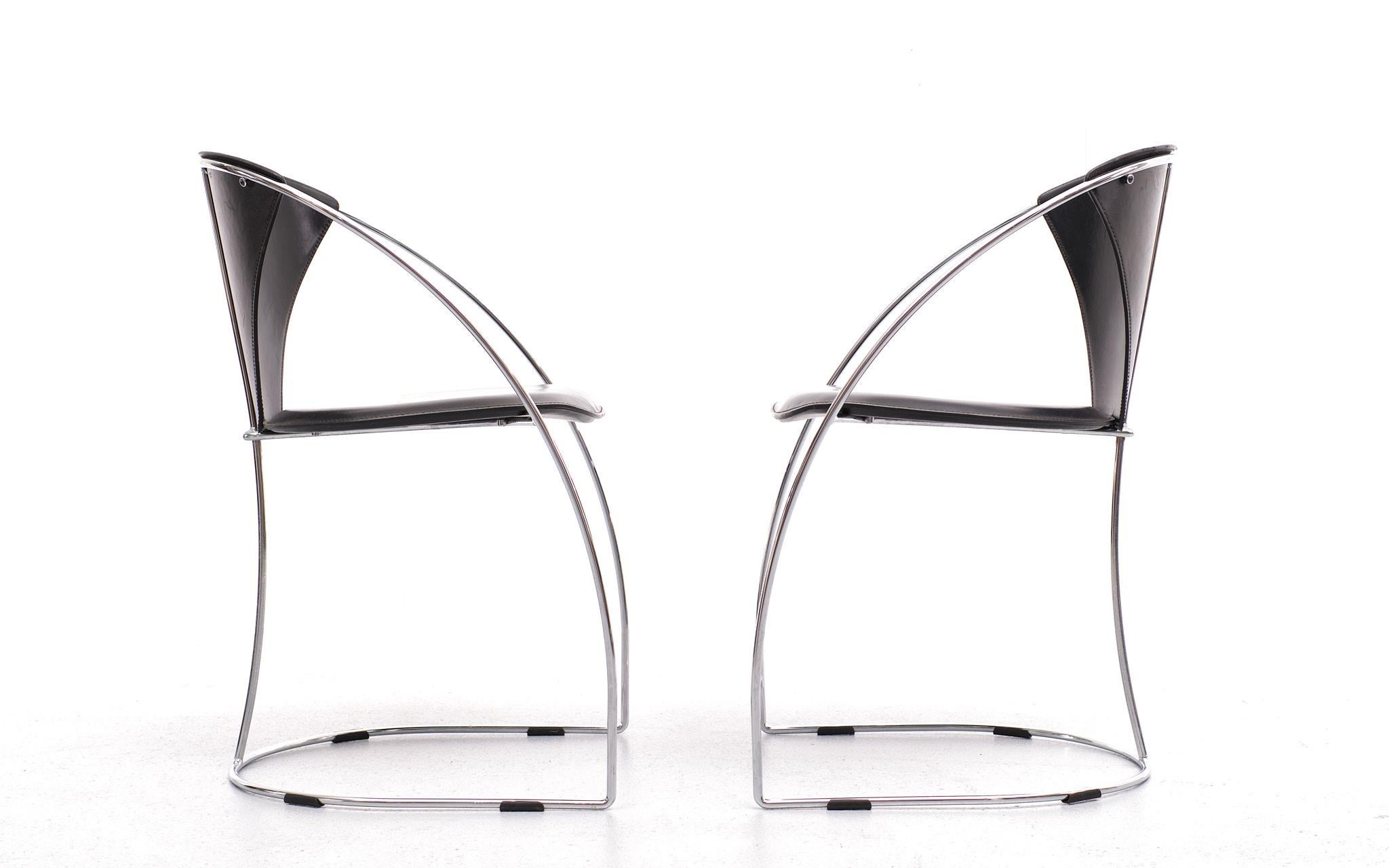 Arrben dining chairs. Model linda Made in Italy 1980s Chrome on Steel frame, comes with a Black leather upholstery. One chair has a repair on the bottom.
 