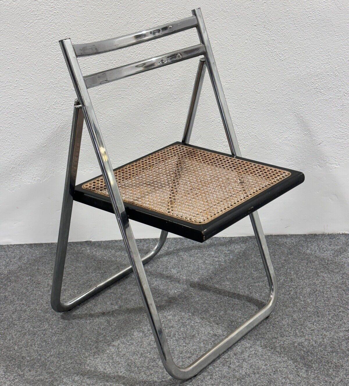 Arrben Italy Flip Chair Rattan 1970's Design Steel Modern.

Chrome-plated steel frame, rattan and wood seat.

In good conservative condition, no cosmetic or structural defects to report, only slight and obvious signs of time due to use and age .
