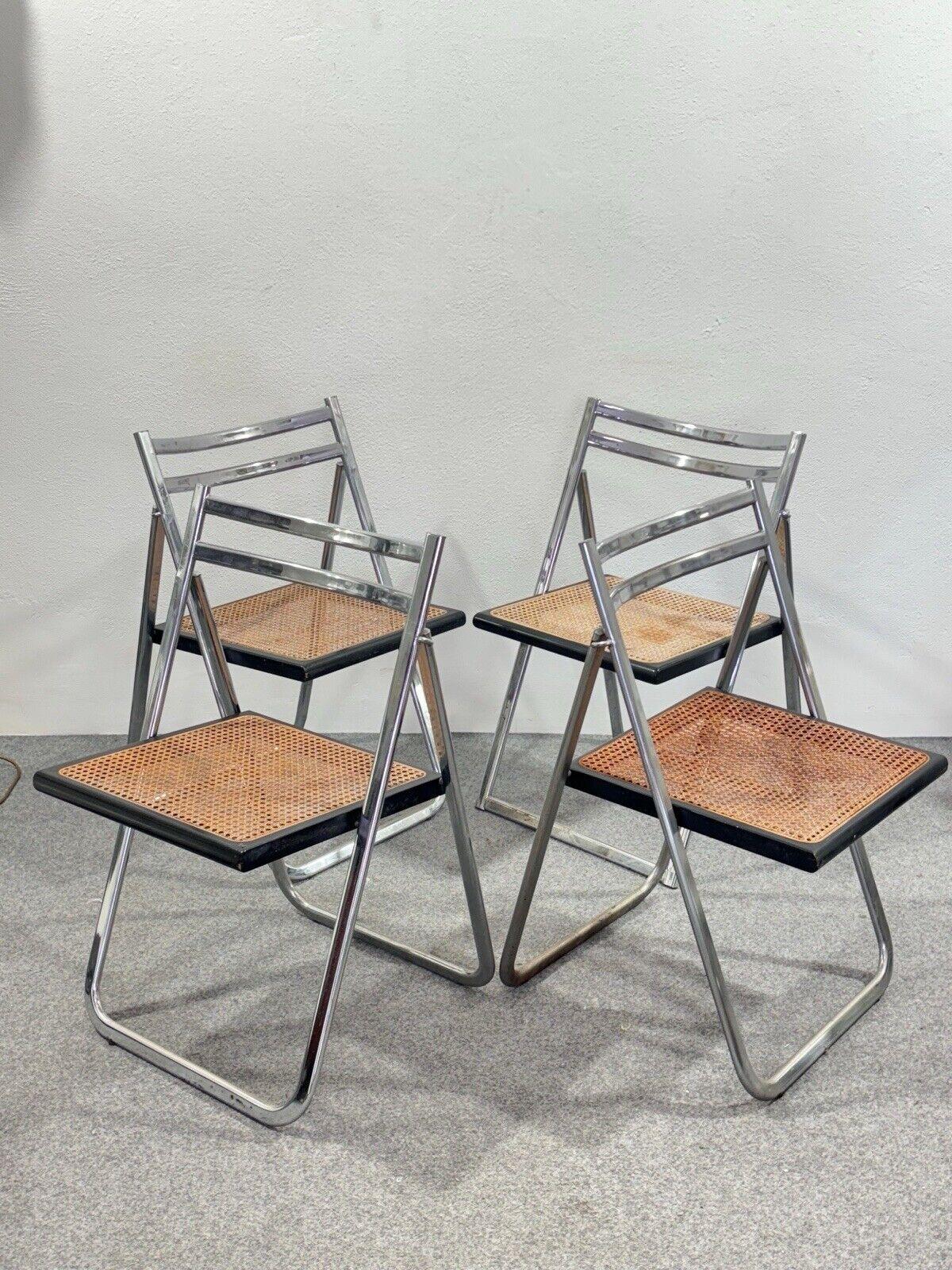 Arrben Italy set of 4 Flip Chair Rattan 1970's Design Modernariato.


Chrome-plated steel frame, rattan and wood seat.


In good conservative condition, no cosmetic or structural defects to report, only slight and obvious signs of time due to use