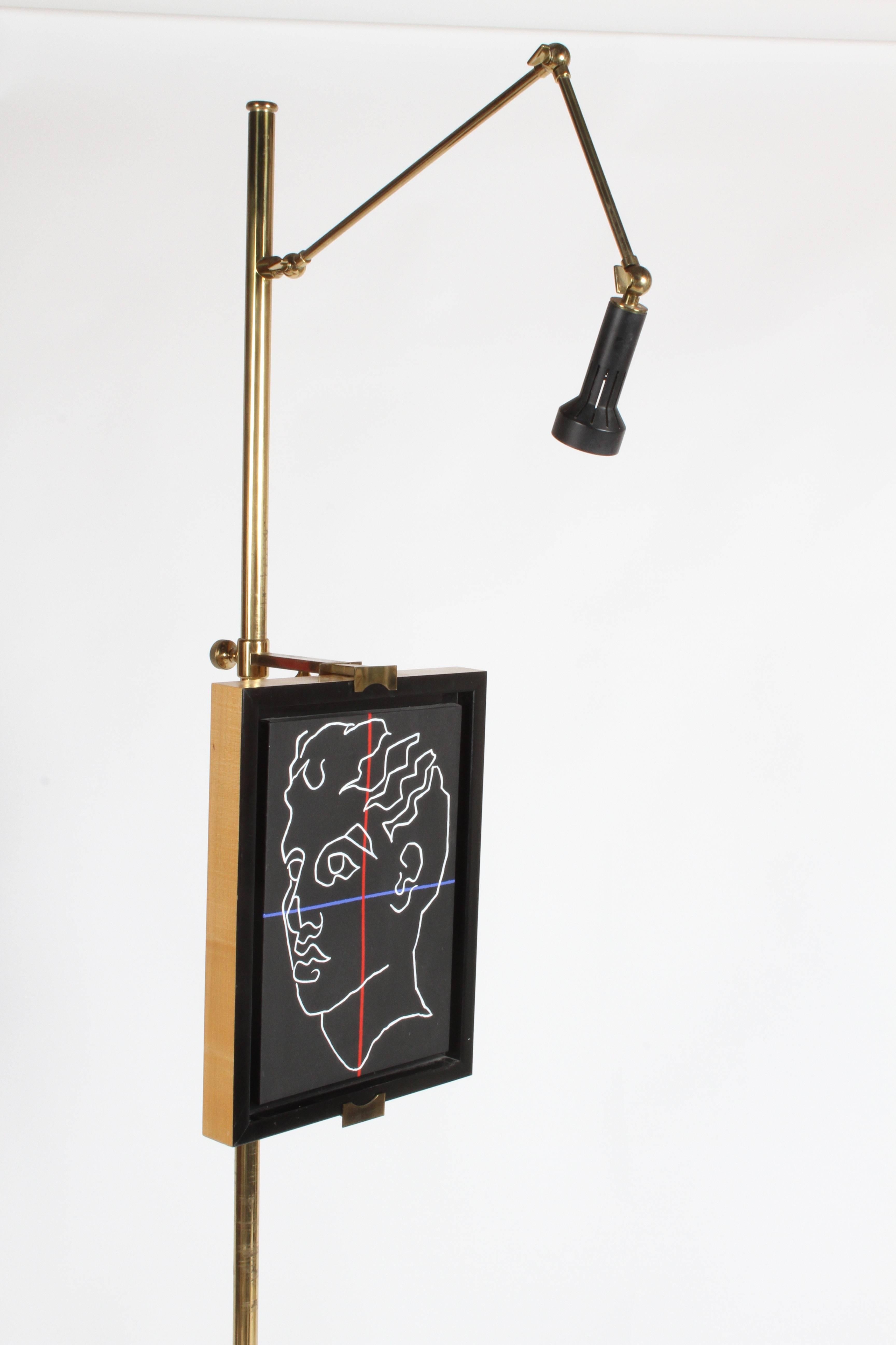 Vintage Arredoluce, Italy, art easel with lamp designed by Angelo Lelli in brass. The easel has an adjustable arm with light. The support brackets adjust up and down, also in and out. Max frame depth is 3-3/8