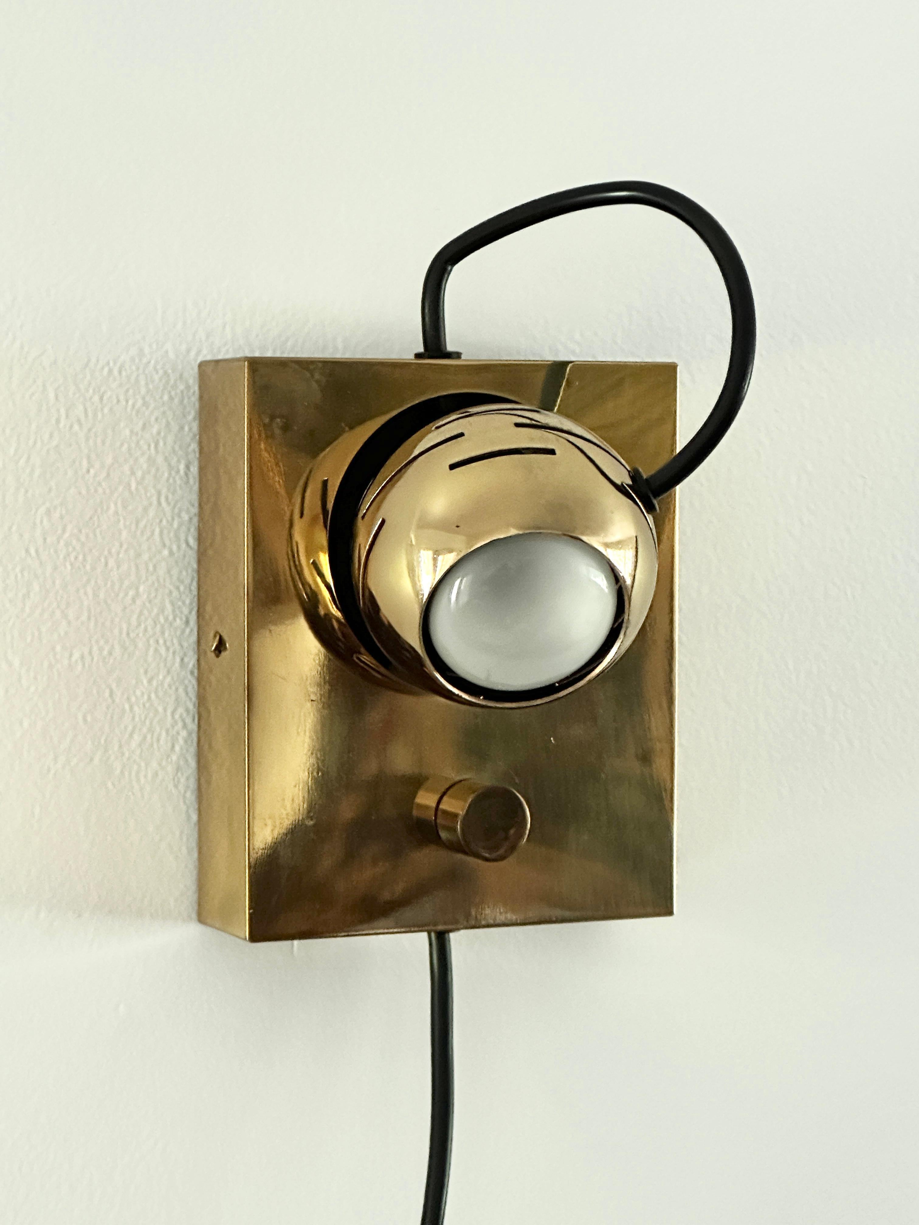 An adjustable “Eyeball” Lamp which was designed as an “Arredoluce Technical Study”, similar to the two “eyeball” wall fixture designed by Angelo Lelli. The lamp was manufacture by Arredoluce, made in Italy, and distributed in the United States by