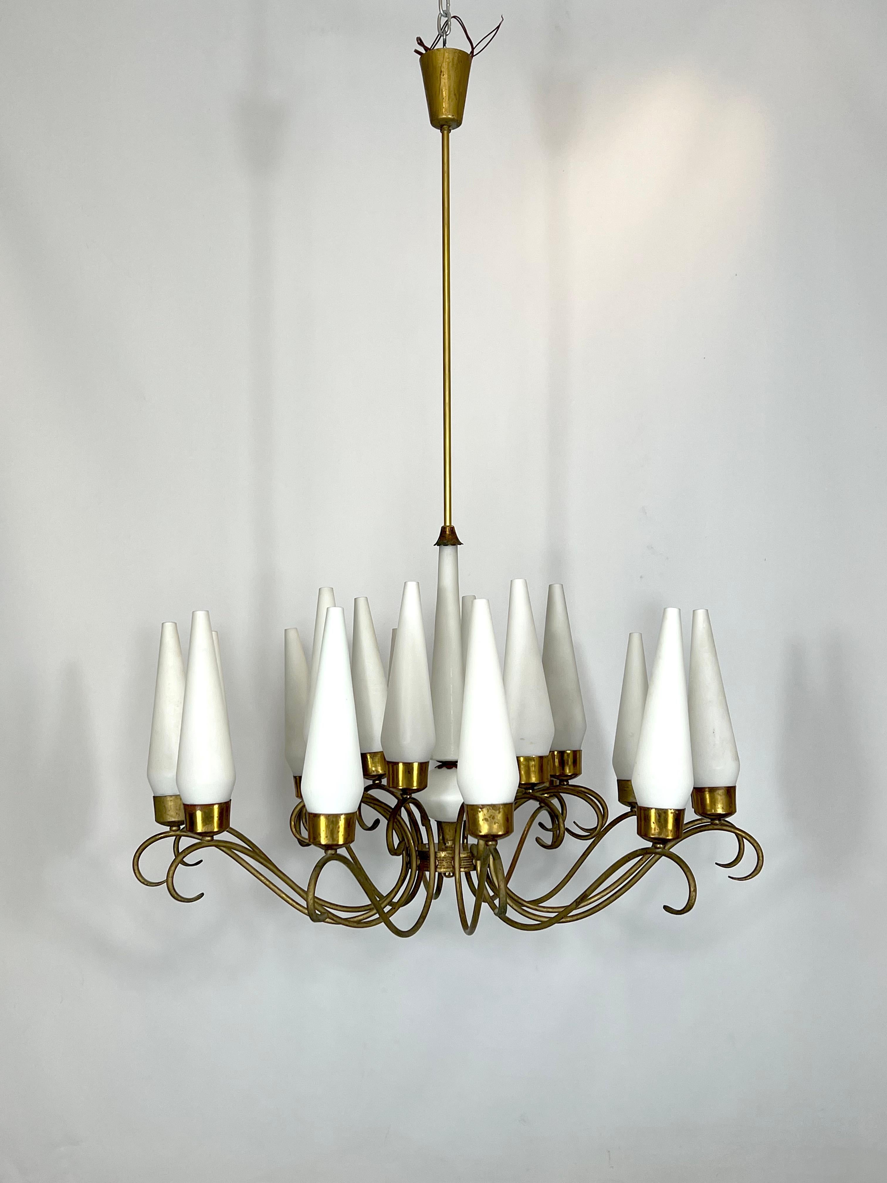 Good vintage condition with trace of age and use for this mid-century chandelier produced in Italy during the 50s and made from brass and opaline glass. No cracks or chips, patina on the brass. Full working with EU standard, adaptable on demand for