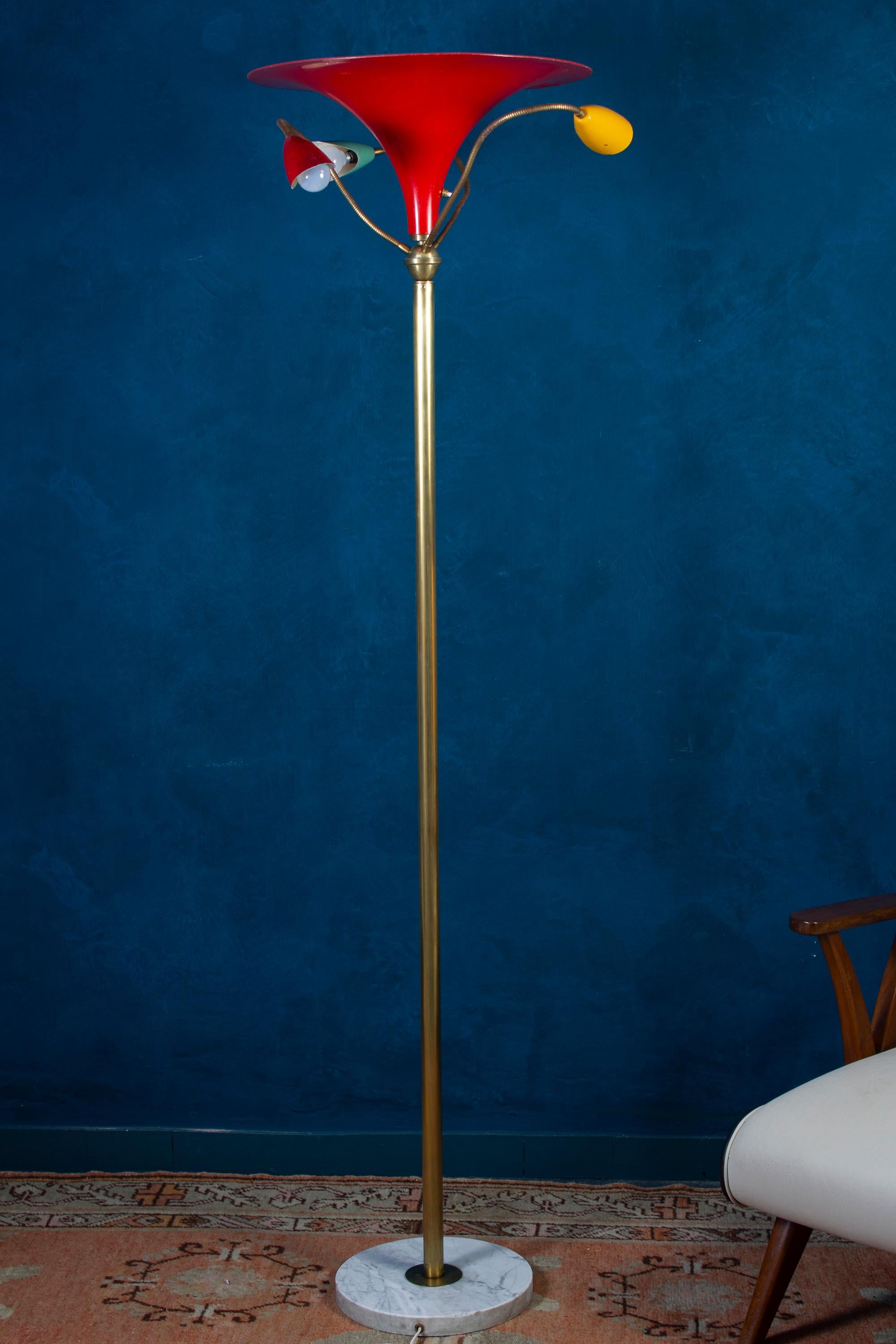 Arredoluce mid - century rare floor lamp by Angelo Lelli, Italy 1949. Centered By a large red lacquered metal shade and brass, three adjustable arms with adjustable color lacquered shades. Round shape veined white Carrara marble base.