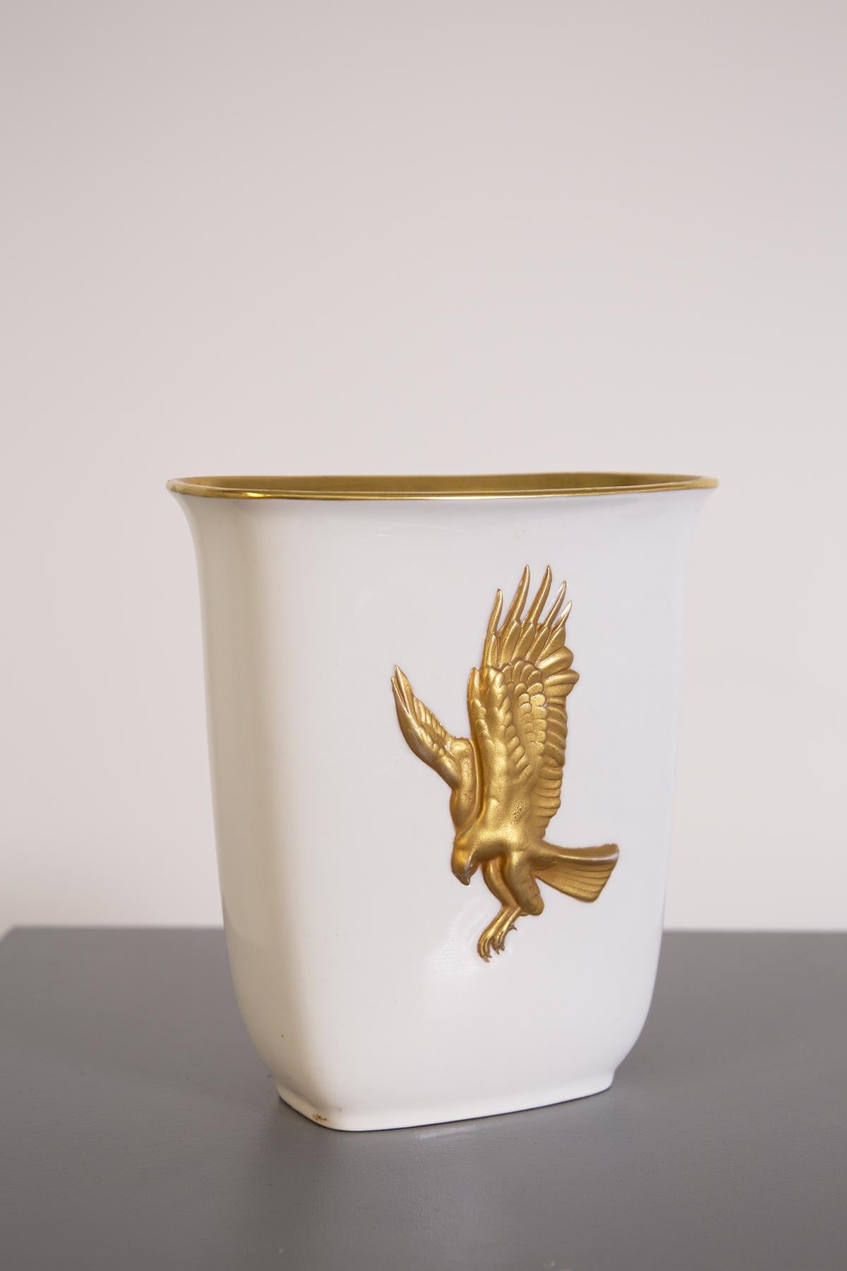 Precious Italian vase from the 1950s made by the great silversmith Arrigo Finzi. The vase has a rectangular shape made of porcelain. Its great elegance and preciousness is given by its entire interior covered in pure gold, and the great mythological