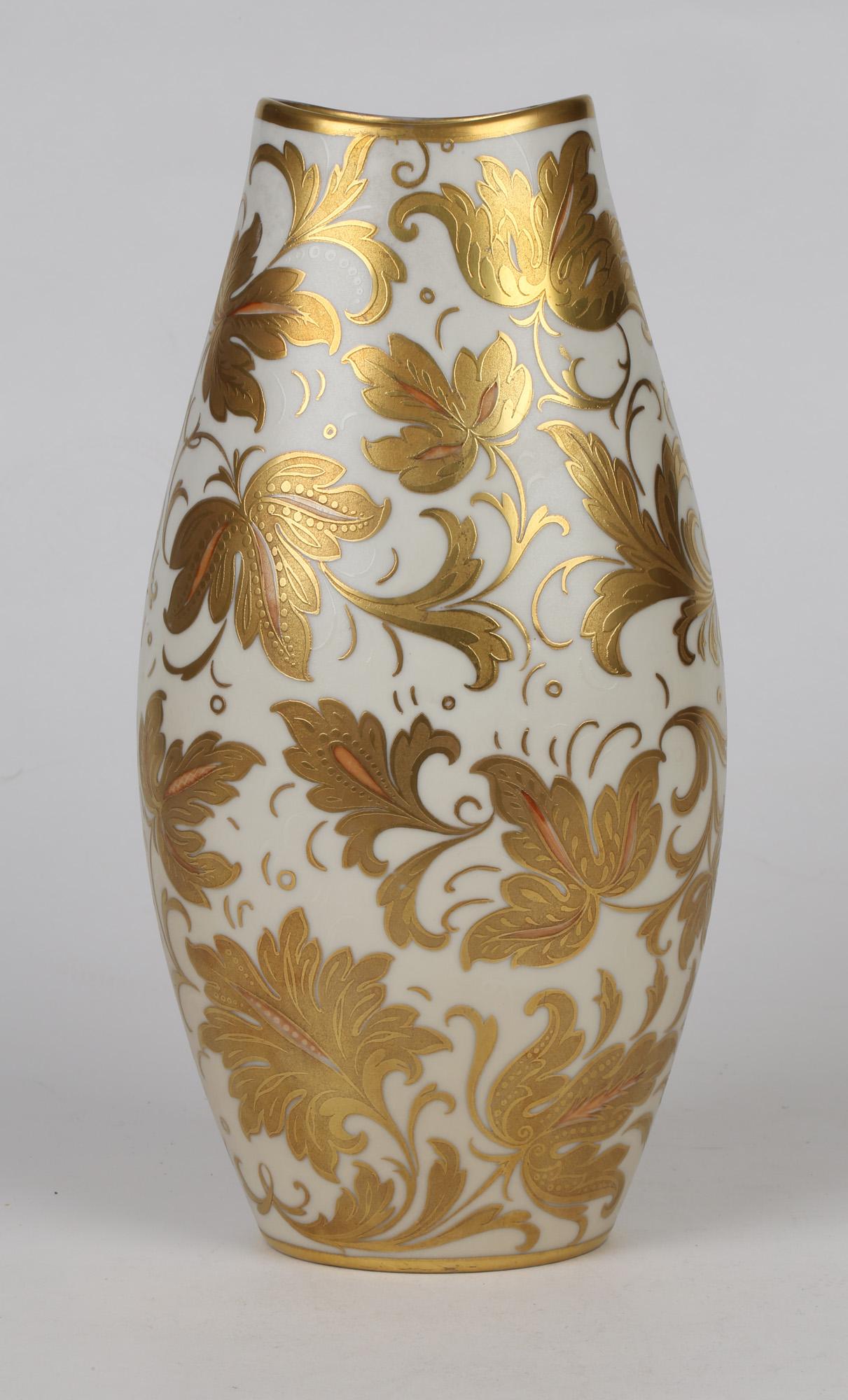 A stunning mid-century Italian Oro Zecchino porcelain vase finely decorated with leaf designs by Arrigo Finzi. This elegantly shaped vase is of slightly compressed oval form standing standing on a narrow oval shaped foot with a fish mouth shaped top