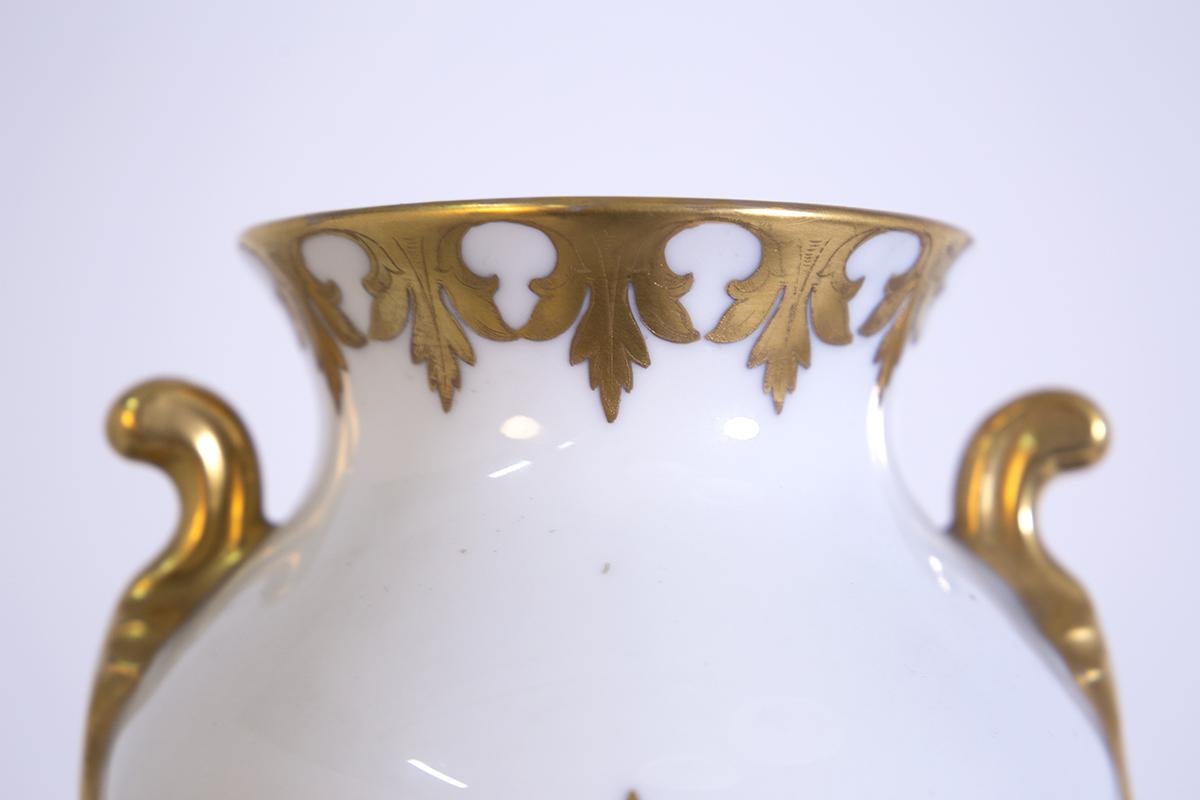 Precious Italian vase from the 1950s made by the great silversmith Arrigo Finzi. The vase is made in fine porcelain. Its great elegance and preciousness is given by its working in pure gold foliage and floral ornaments, and the large decorative