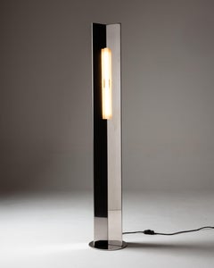 Arrow 158 floor lamp in polished steel by Violaine d'Harcourt
