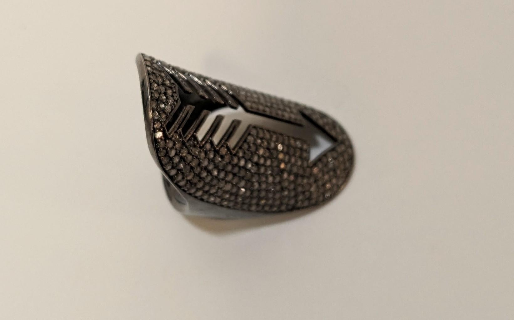 Brilliant Cut Arrow sling Ring in Silver and  Diamonds For Sale