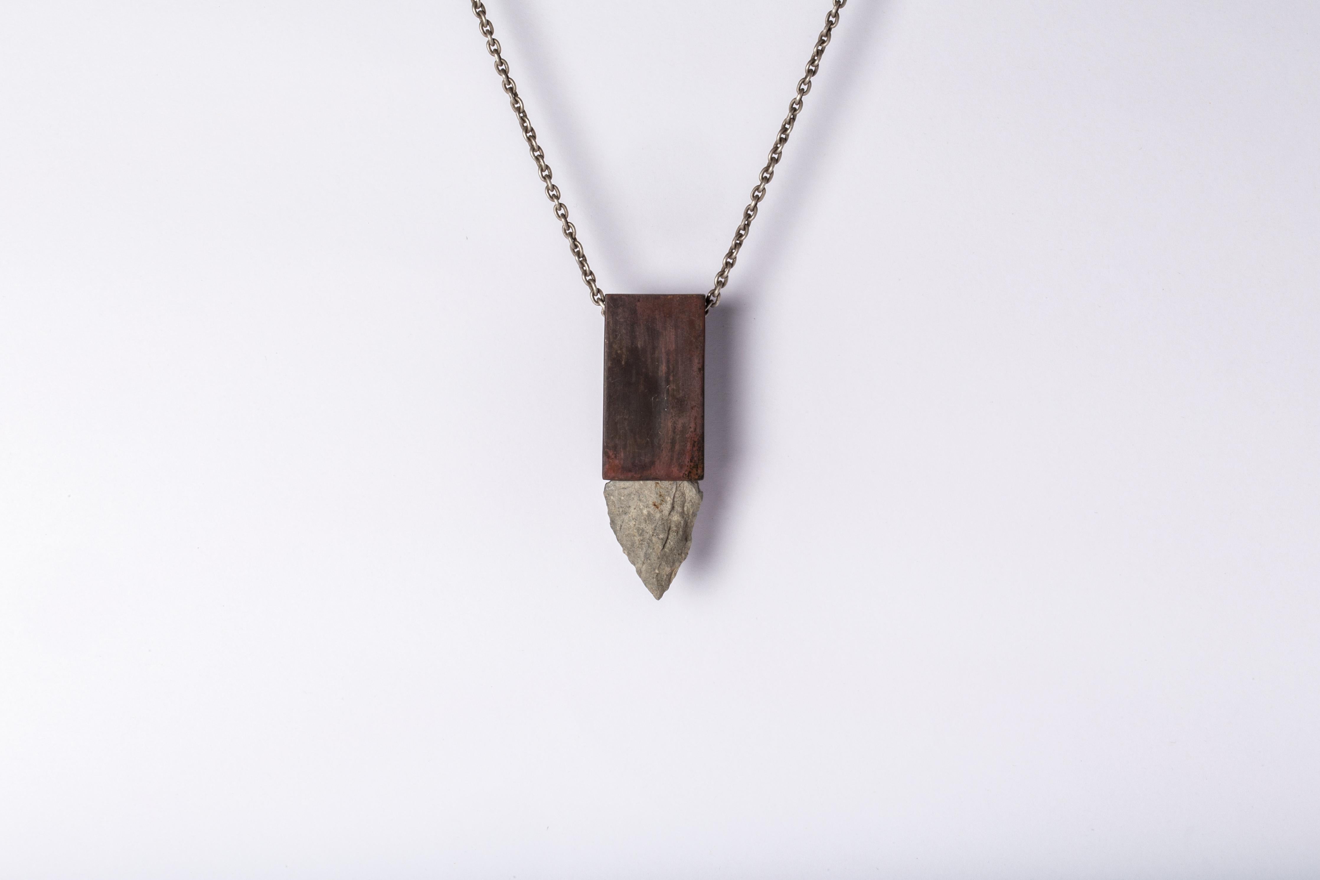 Necklace made in brass, sterling silver, and a rough of arrowhead stone. The brass color is accomplished by burning the metal to the point that it releases its impurities and self colorizes. This patina occurs from within, no chemical was added to