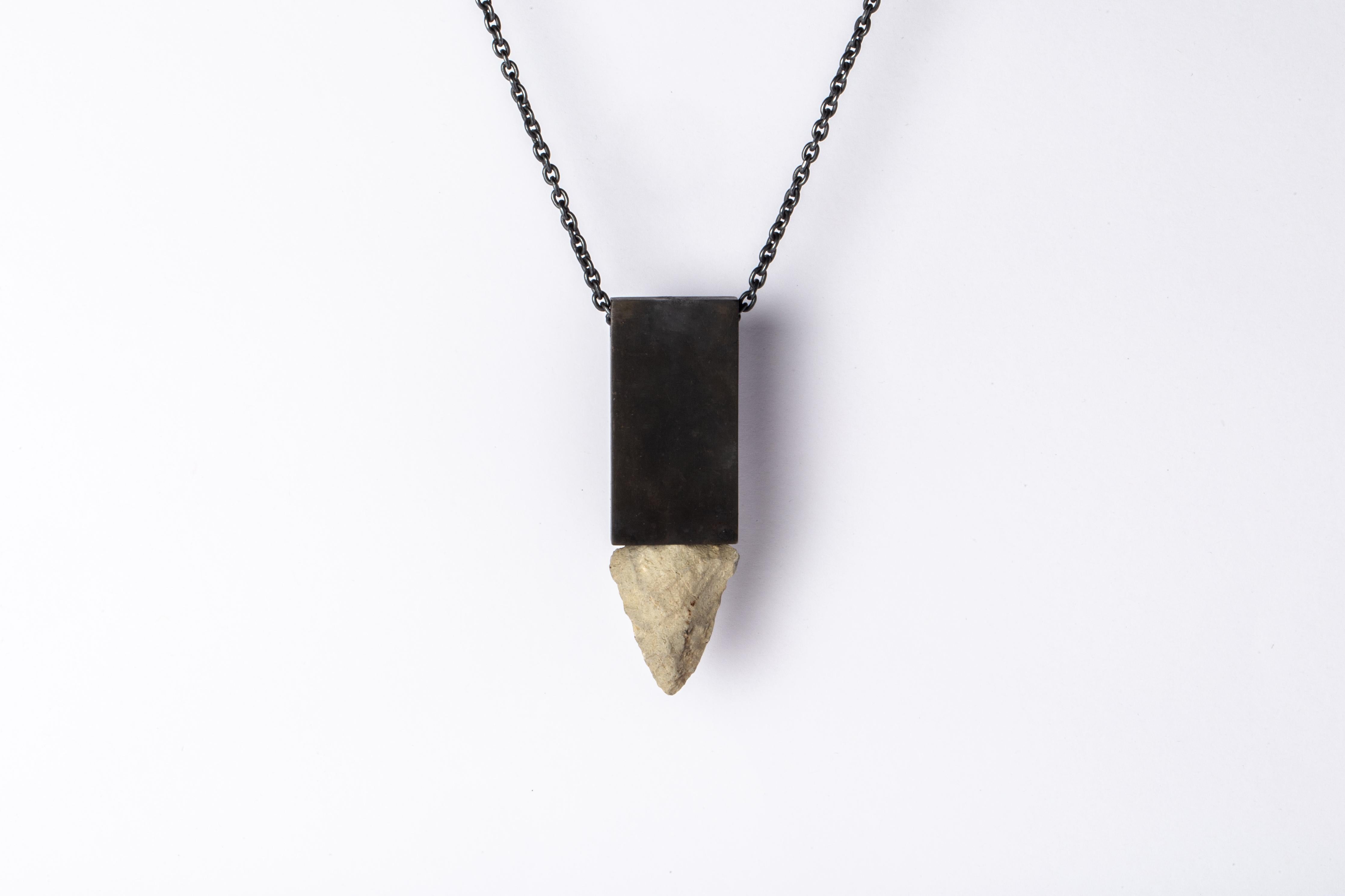 Pendant necklace in the shape of cuboid made in black bronze, oxidized sterling silver, and an arrowhead. The blackened white bronze will fade over time. Please note: This is an irregular, uneven finish and will differ from the photograph. For a