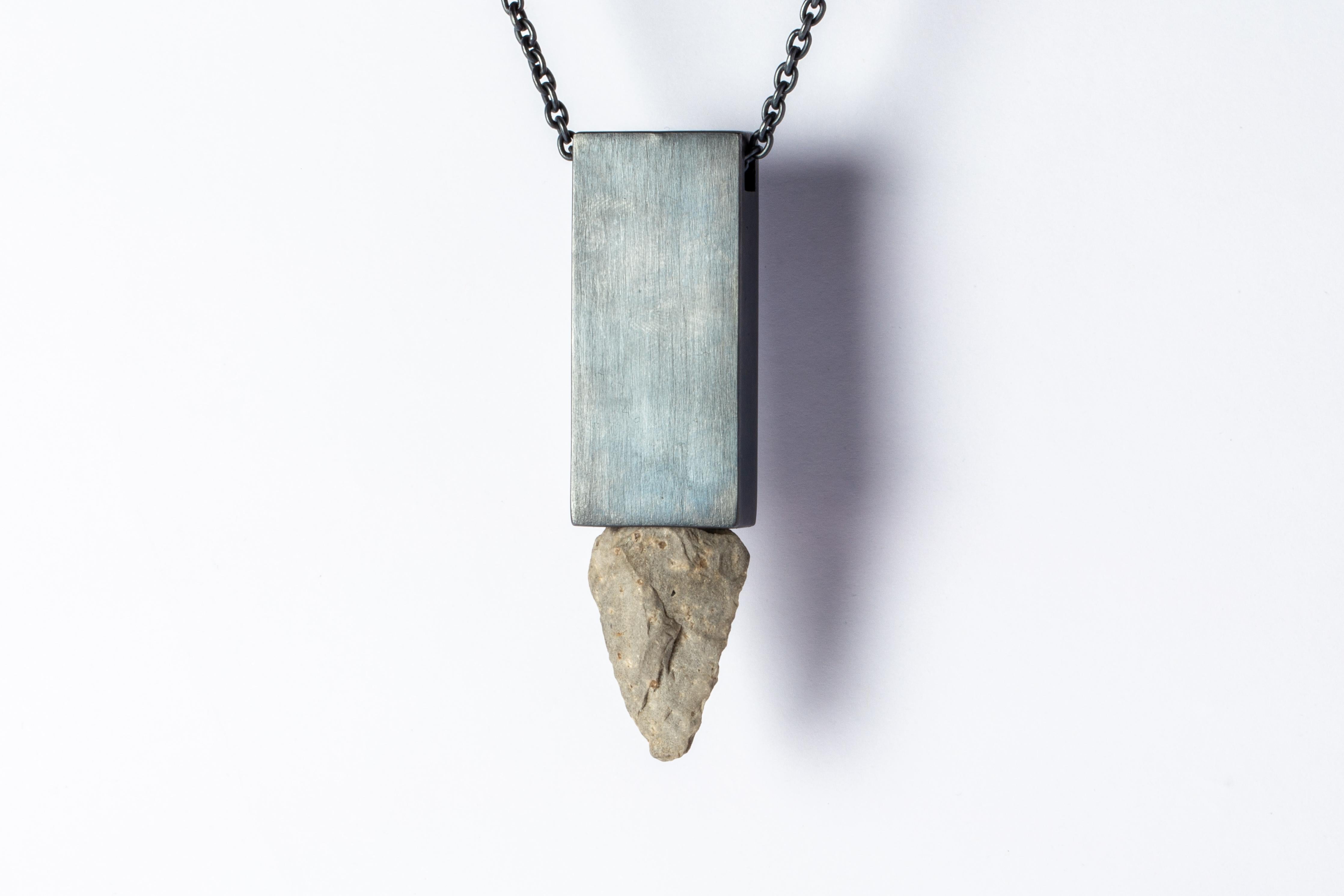Necklace in the shape of cuboid made in oxidized sterling silver and a rough of arrowhead stone. This piece are built using true arrowhead relics. Their wild history creates a depth and magic that is uniquely human. There are currently two design