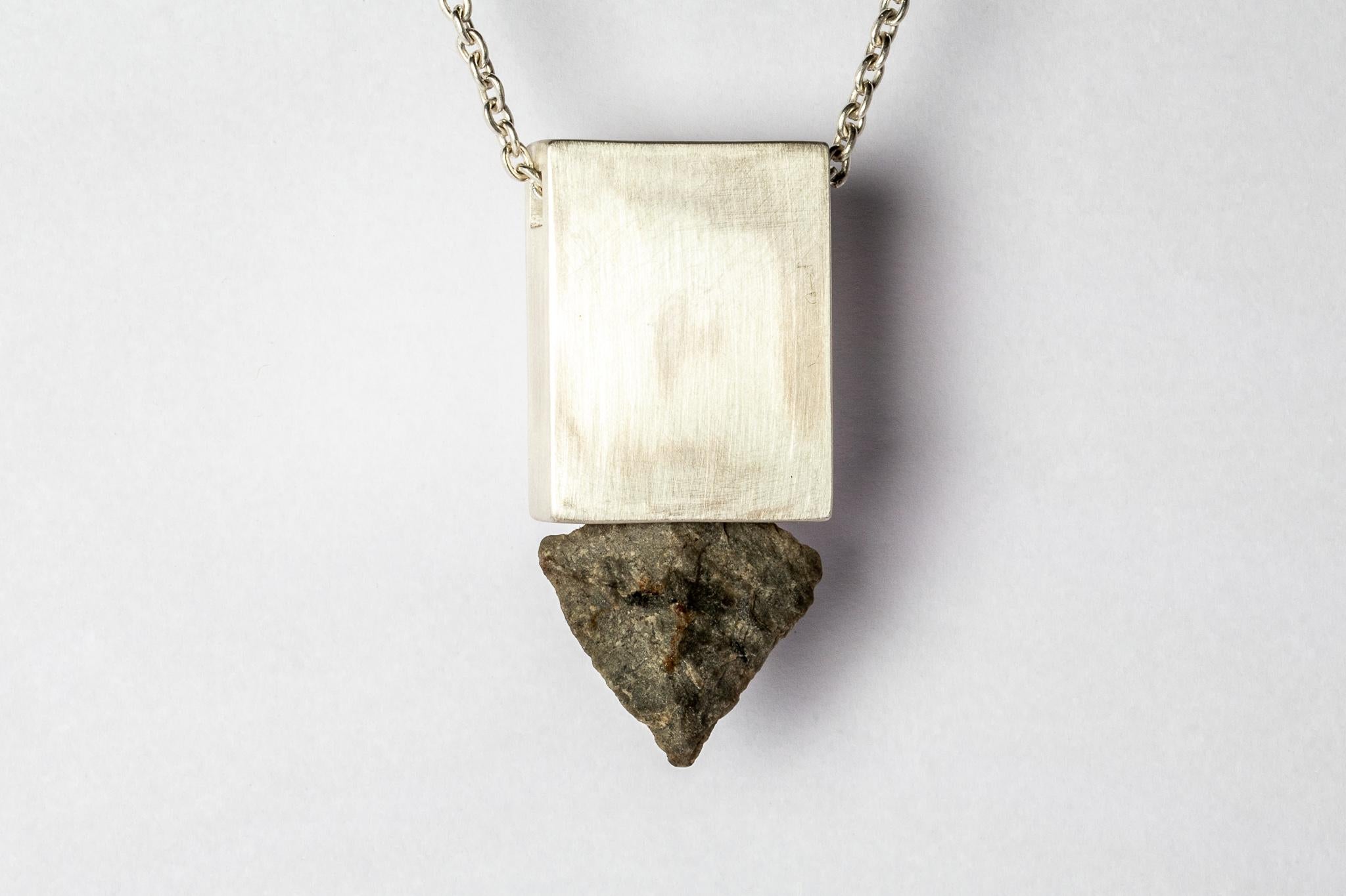 Necklace in the shape of cuboid made in matte sterling silver and a rough of arrowhead stone. These pieces are built using true arrowhead relics. Their wild history creates a depth and magic that is uniquely human. There are currently two design