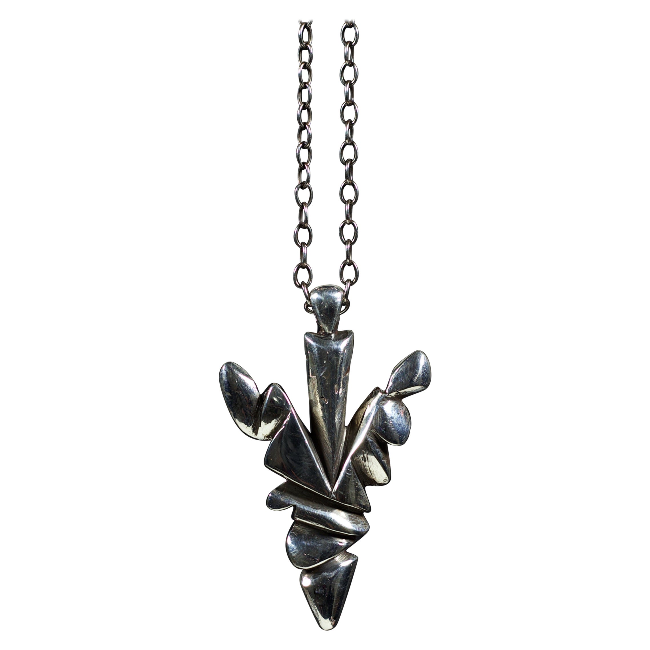 Hand-carved and cast by Ken Fury, the Arrowhead pendant is a symbol of strength, resilience, courage, and determination.

Pendant size: 45 mm x 28 mm

A 20-inch sterling silver chain is included.