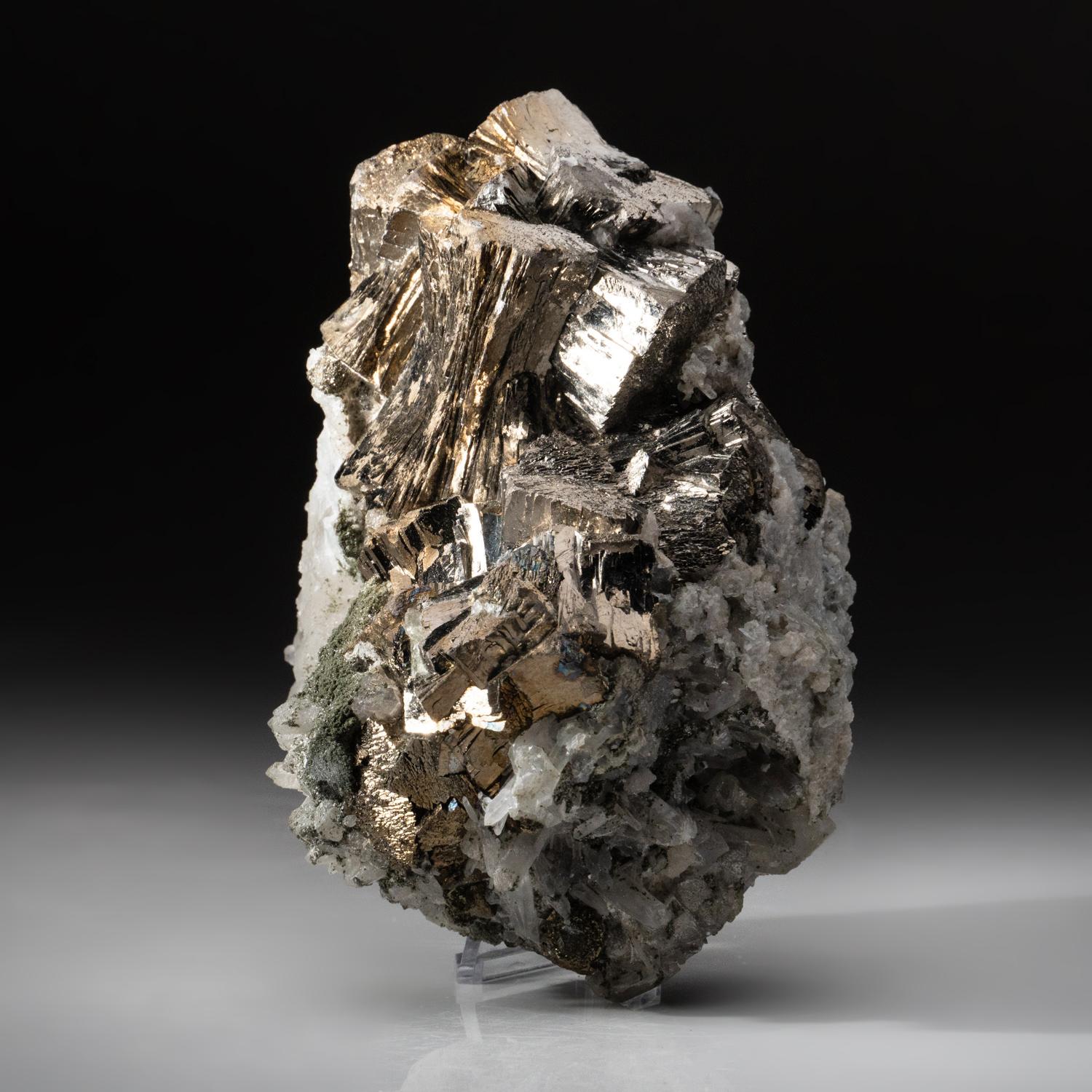 From Huanggang Mine, Kèshíkèténg Qí, Chifeng, Inner Mongolia, China Large specimen of silvery metallic luster arsenopyrite crystals in a subparallel growth formation on gossan matrix with quartz. This piece features a rare combination of