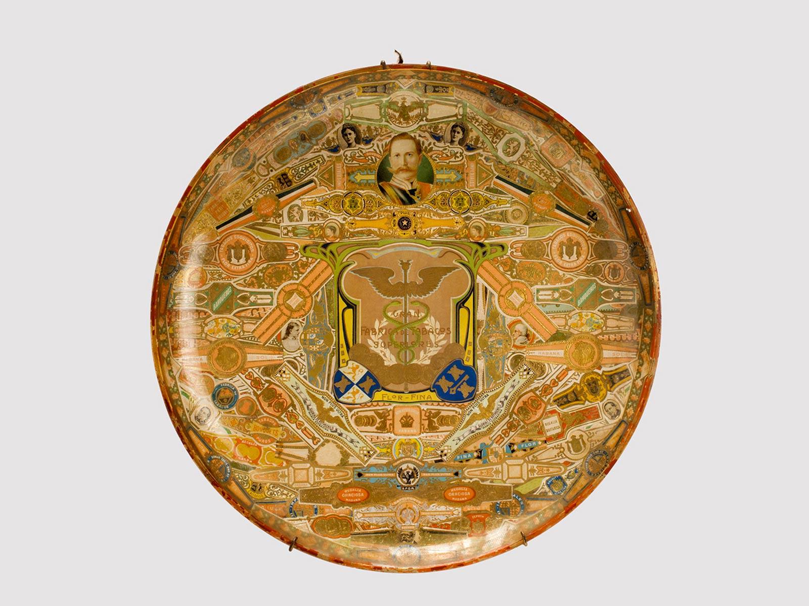 Round shaped glass dish, decorated, with Cuban cigar labels, applied under the glass. Art and Craft period, London circa 1890.