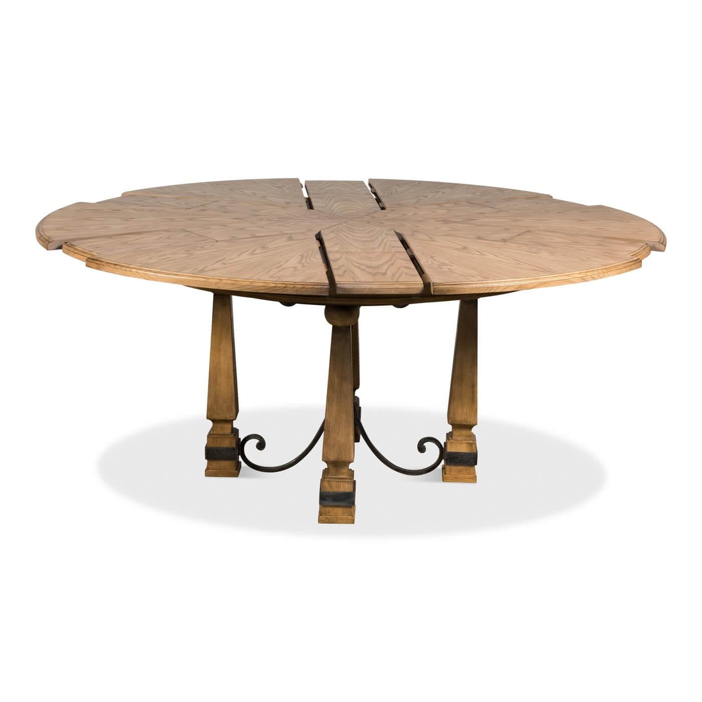 An Art & Crafts-style round dining table, this round extending dining table is crafted in oak and has scrolled iron accents at the base. 

Dimensions: 70
