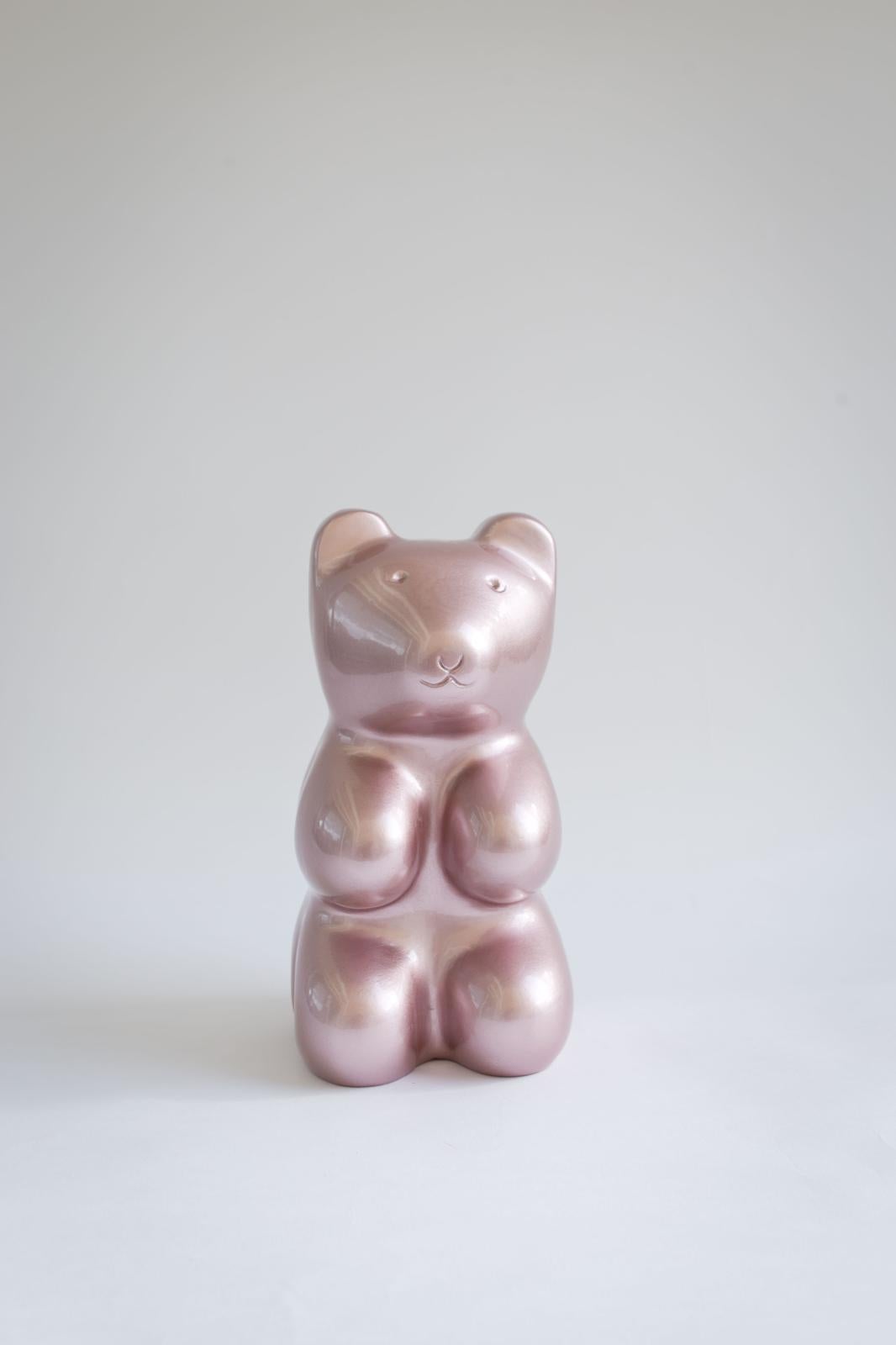 Meet the Gleaming Bears Collection – a heartwarming series of handmade sculptures designed to add charm and sophistication to your space. Featuring an adorable bear figurine in a lustrous metallic pink finish, this piece brings a touch of