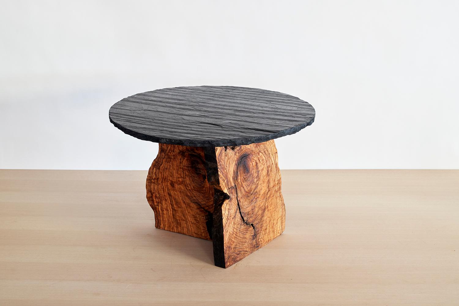 Art Brut Center Table by Jean-Baptiste Van Den Heede
Unique piece
Dimensions: D 60 x H 41 cm
Materials: Natural olive wood and Slate stone.

Living room table from the ART BRUT collection. A functional sculpture that can be seen as a side table as