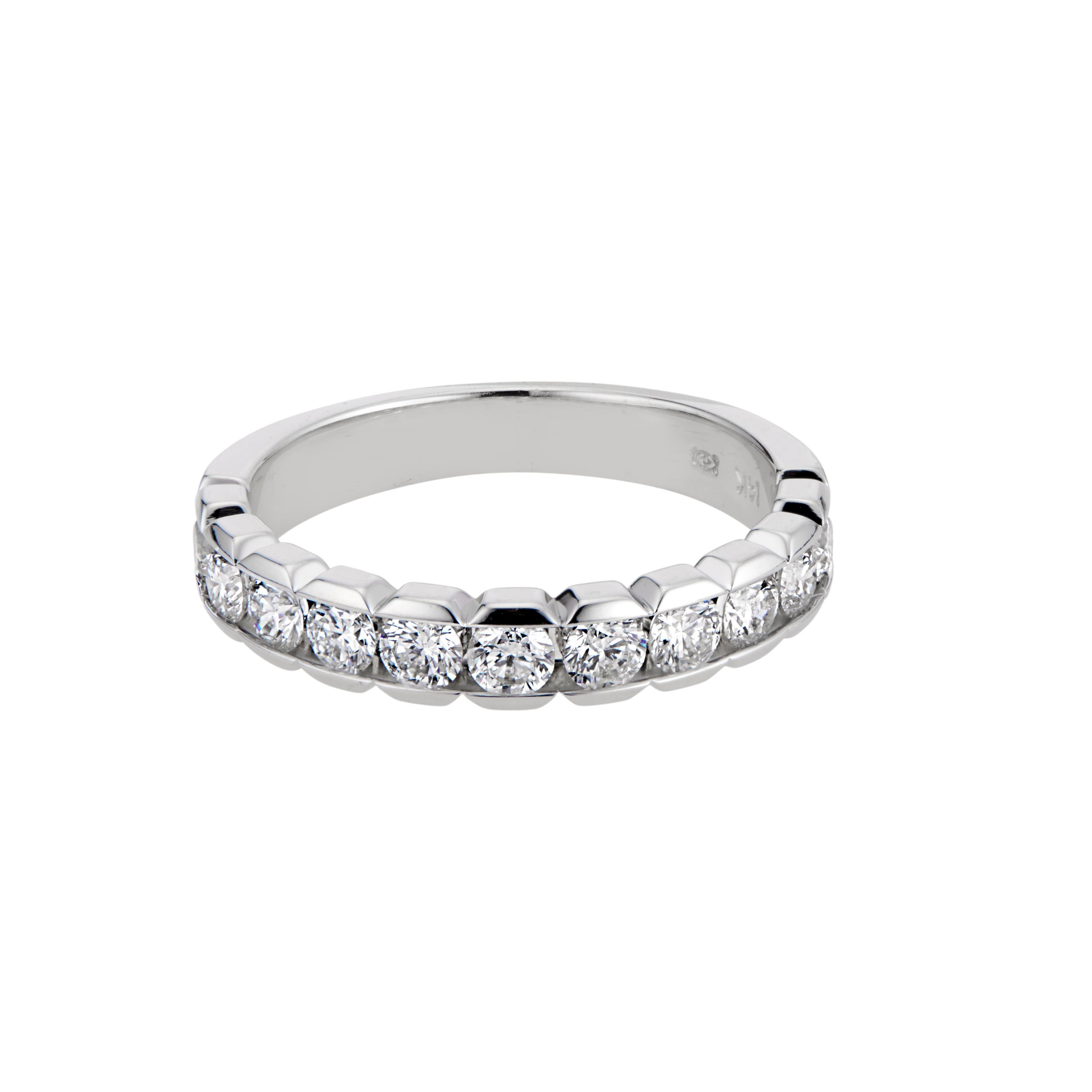 Art carved white gold ring. 11 round cut diamonds set in a platinum wedding band setting. 

11 round brilliant cut diamonds, G-H VS-SI approx. 1.11cts
Size 6 and sizable up/down one size
Platinum 
Stamped: Artcarved
9.1 grams
Width at top: 4.9mm