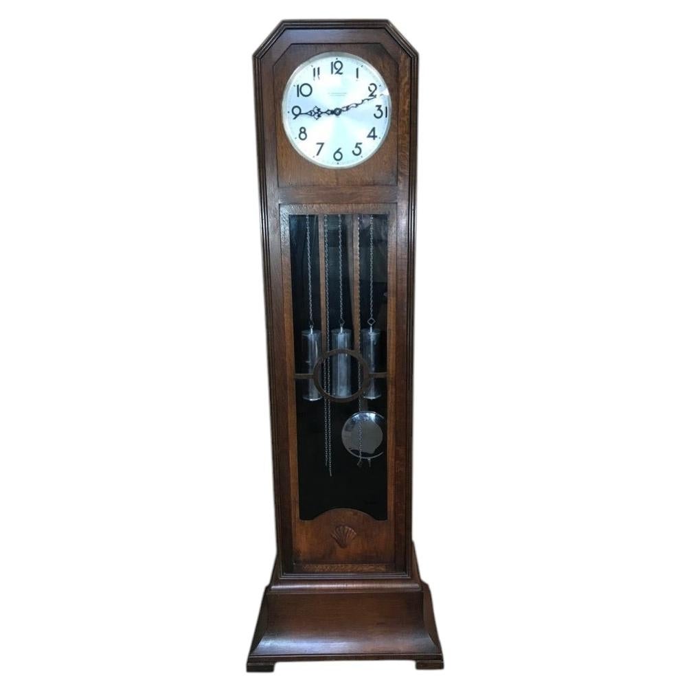 Art & Craft tall case clock by the respected makers W. Greenwood & Sons For Sale