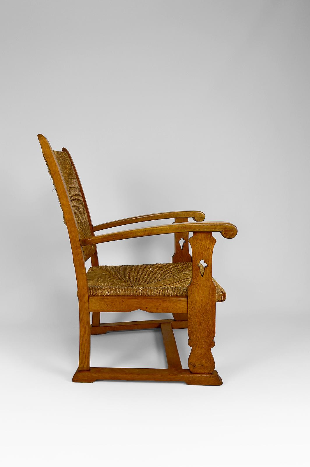 Early 20th Century Art & Crafts / Gothic Revival Armchair in Oak and Straw, circa 1900