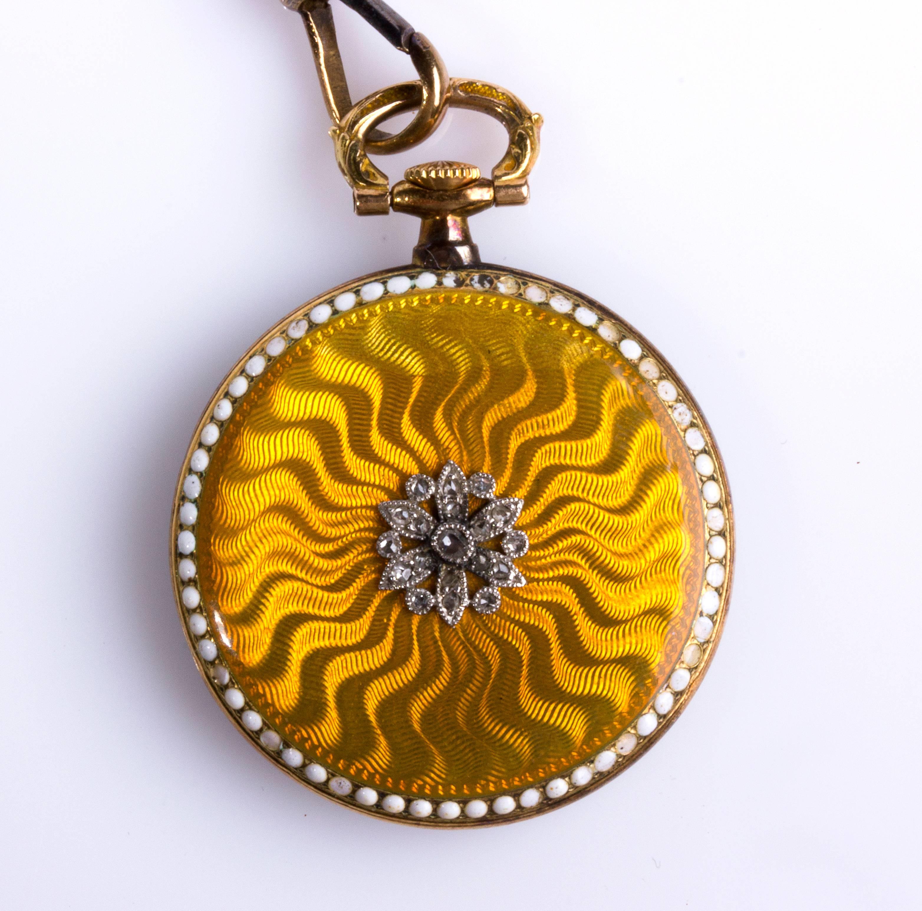 Flower motif set rose cut diamond, gold chain decorated with pearl and enamels. Mechanical movement. 