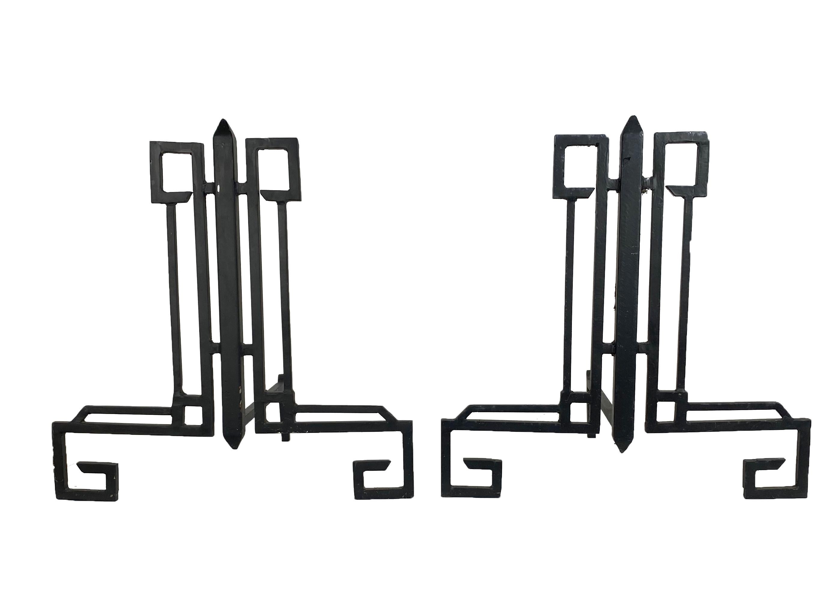 These wrought iron  fireplace Andirons could be classified Art Deco or Midcentury. They will do the job intended and look good doing it.  The iron fireplace log holders will work with log burning, or gas fireplace logs.  The geometric design made of