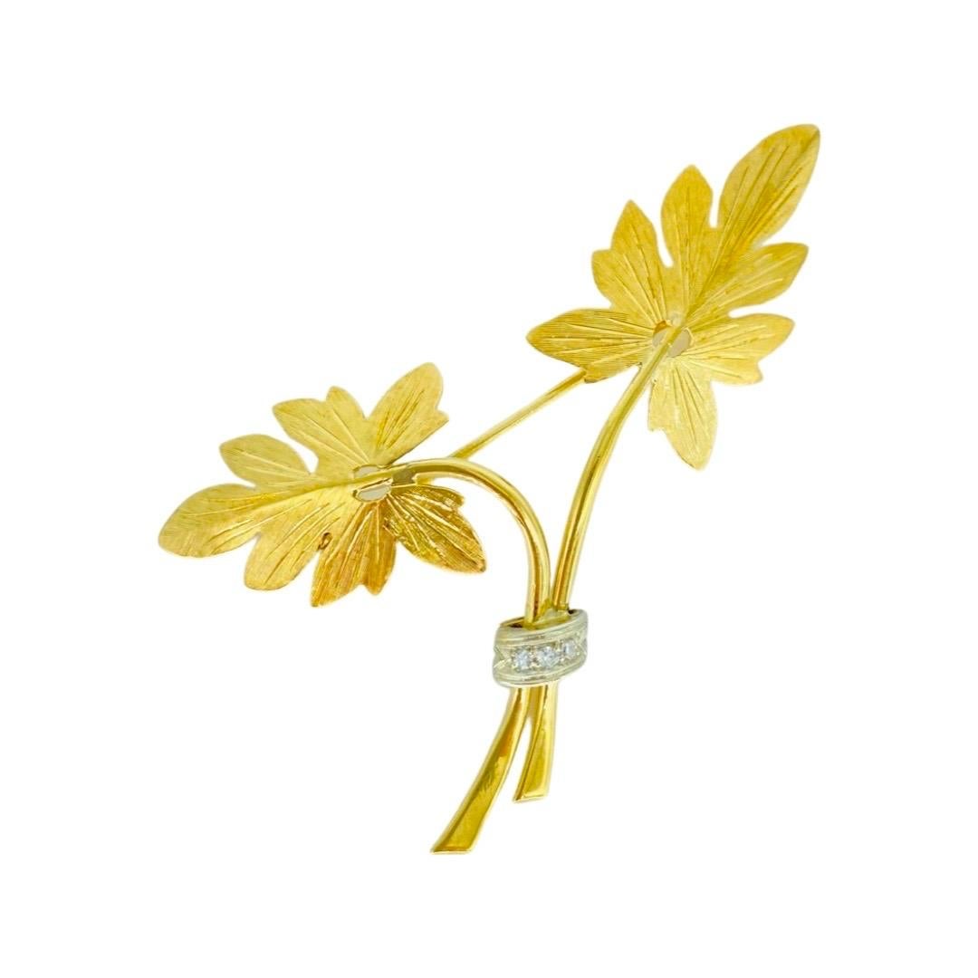 Art Deco 0.06 Carat Diamond Petiole Leaf Brooch Pin in 18k Yellow Gold. Absolutely stunning art work and design by the designer on this Petiole Leaf brooch with approx 0.06 carat in total diamond weight grabbing the two petioles in 18k white gold.