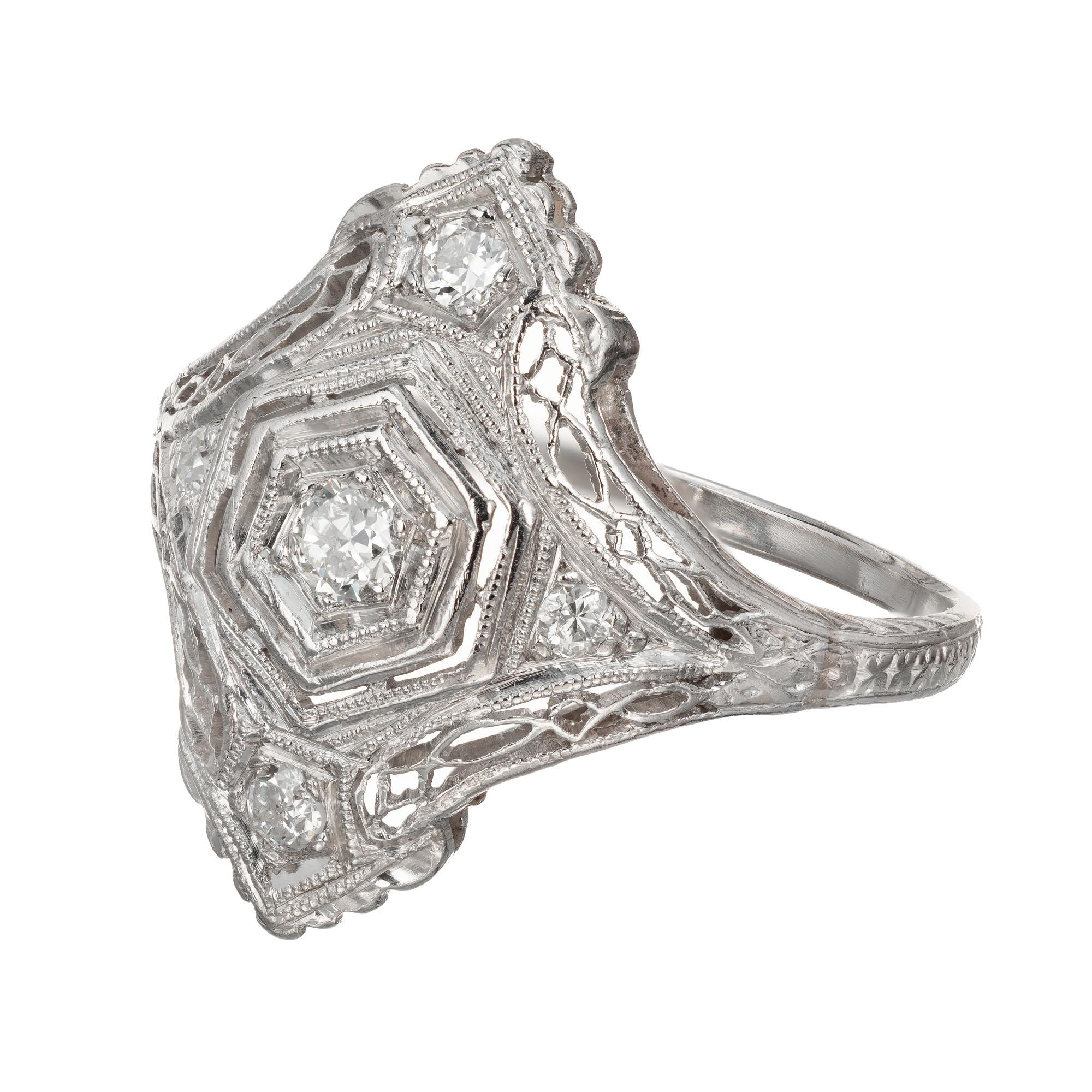 Art Deco 1920's Diamond filigree Platinum hand pierced and hand engraved ring. European full cut diamonds. Handmade.

5 European cut diamonds, approx. total weight .12cts, H, VS2 - SI1
Size 6+ and sizable
Platinum
Platinum 950
3.0 grams
Stamped: