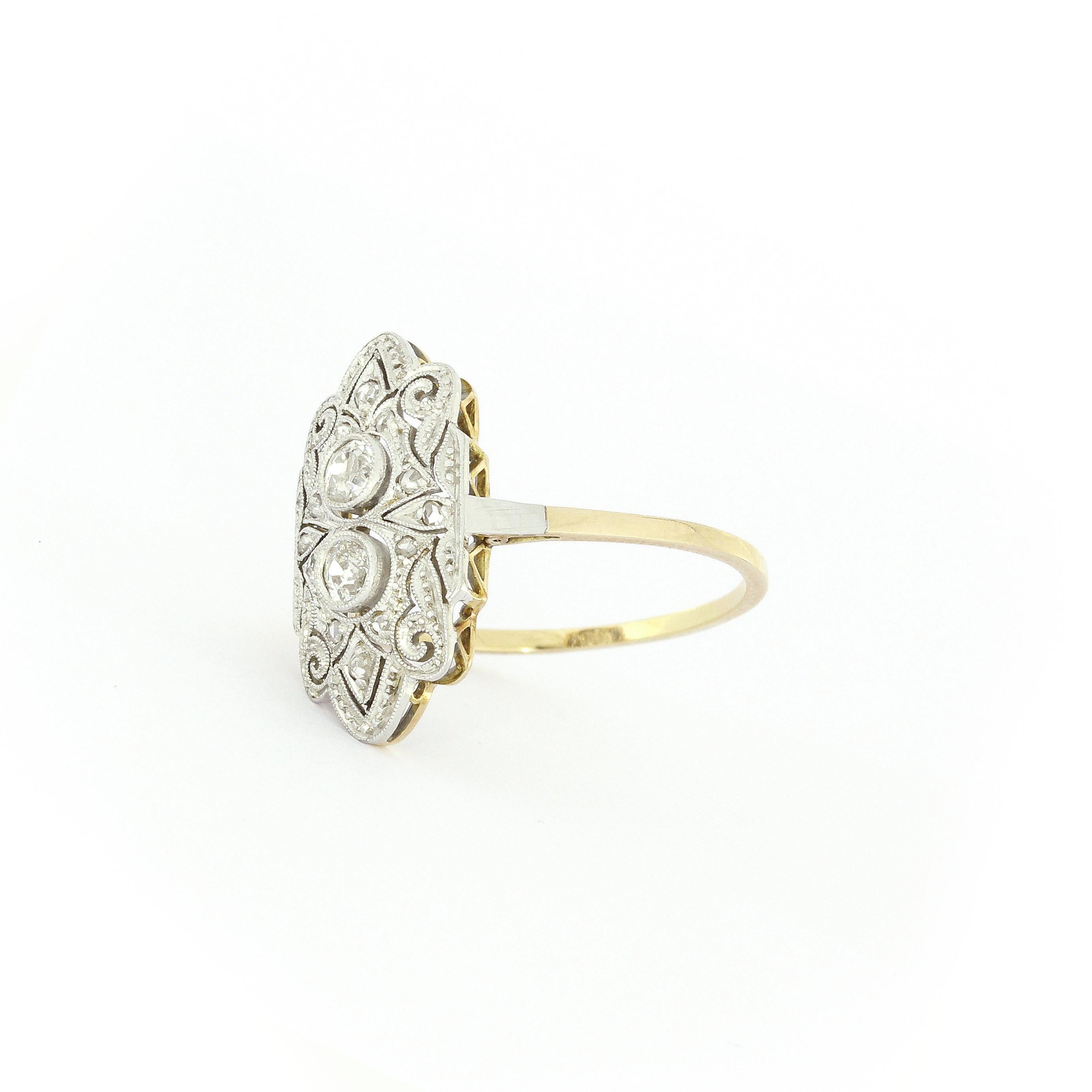 Art Deco Ring with 14 Old European Cut Diamonds approx. 0.42 Carat in White and Yellow Gold

Measurements
L: 19mm
W: 10mm
H: 11mm