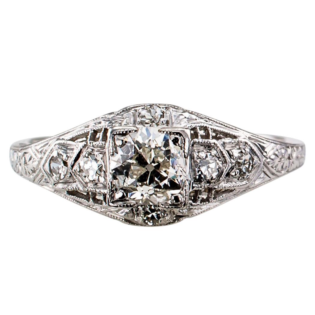 Art Deco 0.44 carat old mine-cut diamond engagement ring mounted in platinum circa 1925. The petite design centers upon an old mine-cut diamond weighing approximately 0.44 carat, approximately H color and SI1 clarity, on a genuine Art Deco platinum