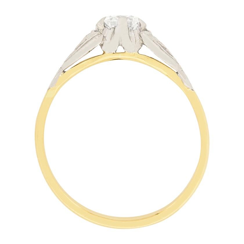 A beautiful 0.45 carat transitional cut diamond is showcased in this Art Deco Engagement Ring. The diamond is F colour and VS2 clarity. It is claw set in the patterned platinum shoulders. The band is made of 18 carat yellow gold. This ring was made