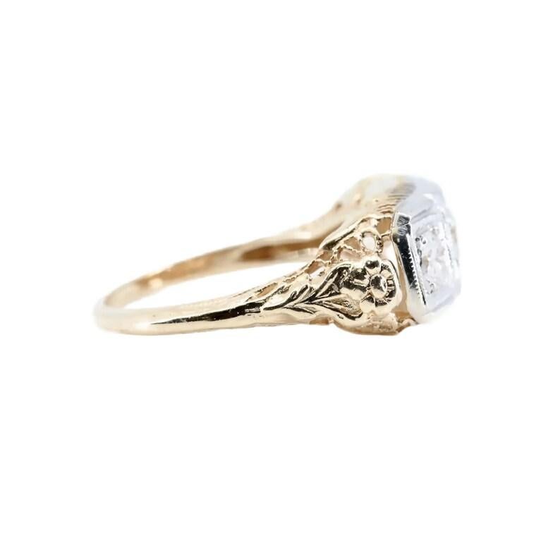 Aston Estate Jewelry Presents:

A vintage late Art Deco period three stone diamond ring. Featuring beautiful die struck flowers complemented by pierced filigree work and hand engraved detailing. Centering this ring are a trio of sparkling round cut