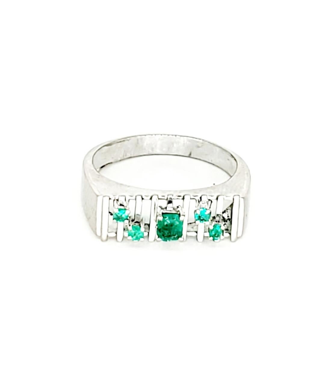 Art Deco Style 0.50 Carat Emerald Ring. The ring feature an Art Deco Style design consisting of 5 emeralds totalling approx 0.50 carats in weight . The ring is a size 7 and weights approx 3.6 grams 18k white gold.