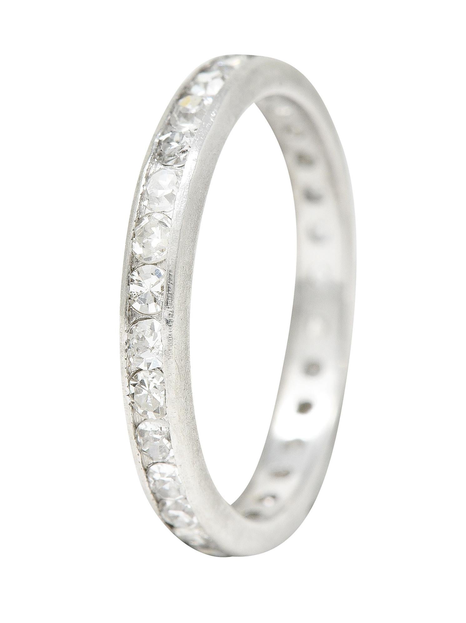 Eternity band ring is channel set fully around by single cut diamonds. Weighing in total approximately 0.50 carat - G/H color with SI clarity. Tested as platinum. Circa: 1930s. Ring Size: 4 1/2 & sizable. Measures: North to South 2.5 mm and sits 1.5